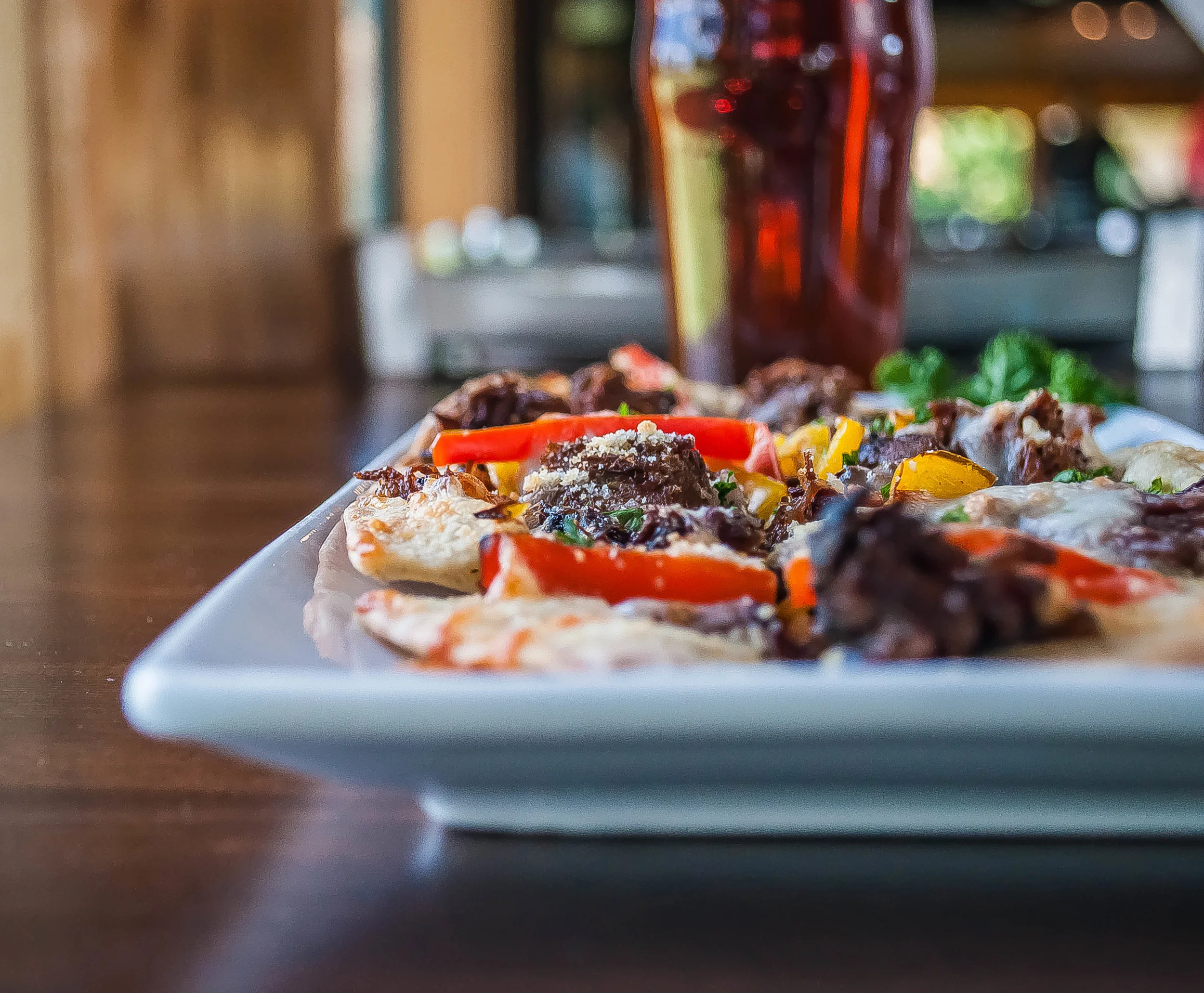Fresh peppers and house smoked brisket come together on our cracker-thin flatbread.