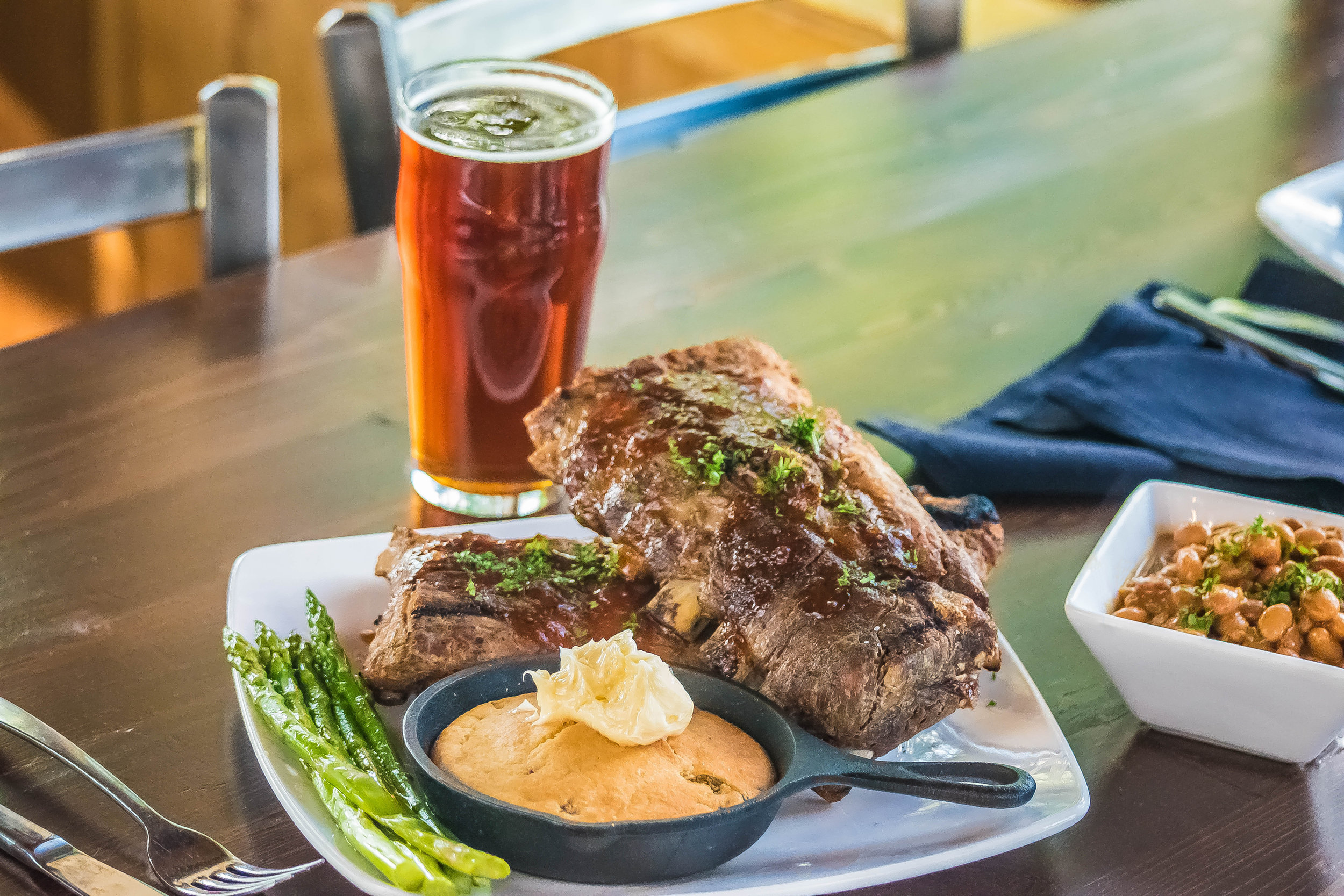 Take your weekend to the next level with mouthwatering baby back ribs and classic smoke house sides like baked beans, cast iron skillet corn bread and grilled asparagus.