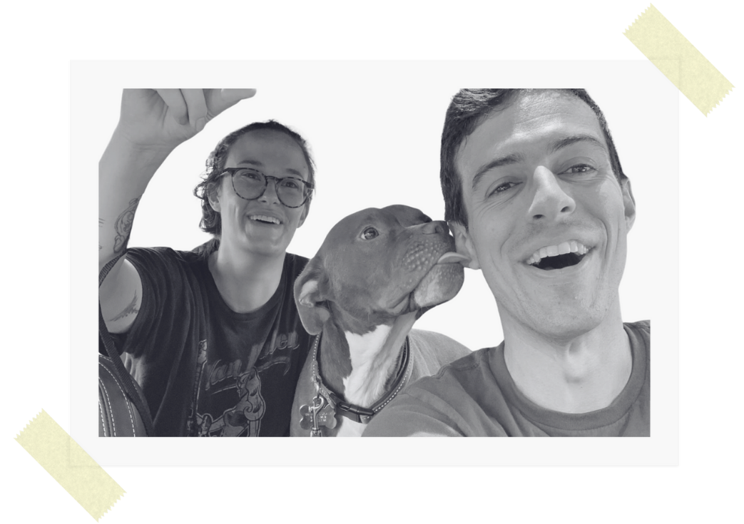 A selfie of the founder of Making Fetch Happen with her partner smiling, with a dog licking the man's face.