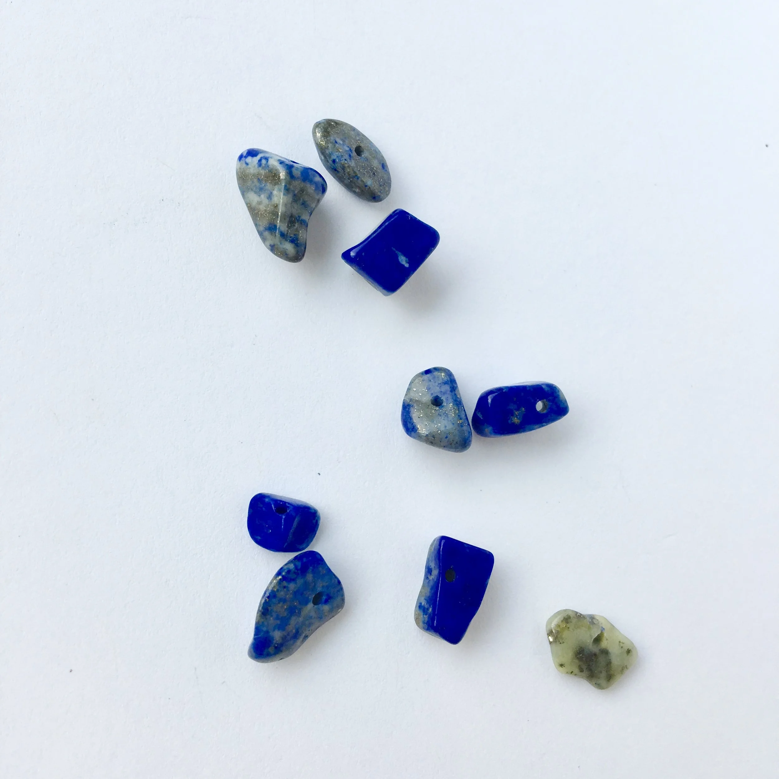 Lapis Lazuli: Promotes communication, truth and justice. Balances Throat Chakra.
