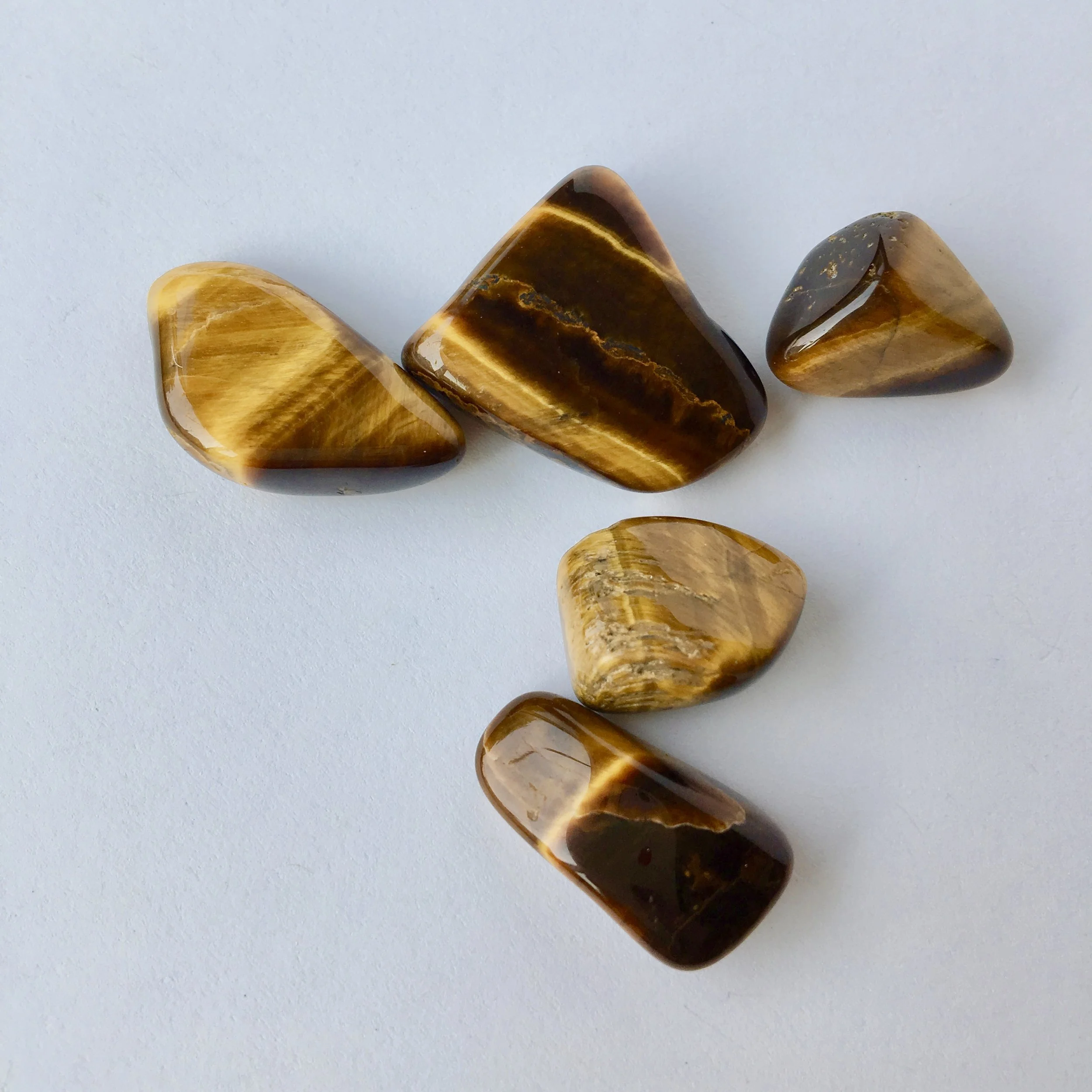 Tiger's Eye: Protection, grounding, encourages confidence, soothing. Helps alleviate stress and anxiety.