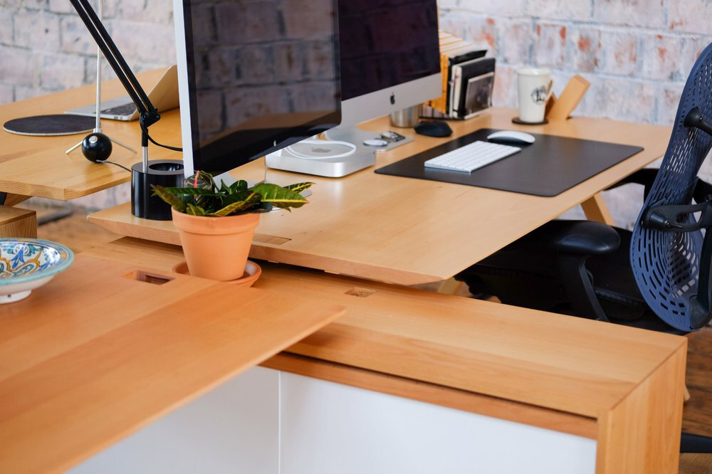  Using the slot near the top of the storage unit, the desks may be mounted in any configuration. 