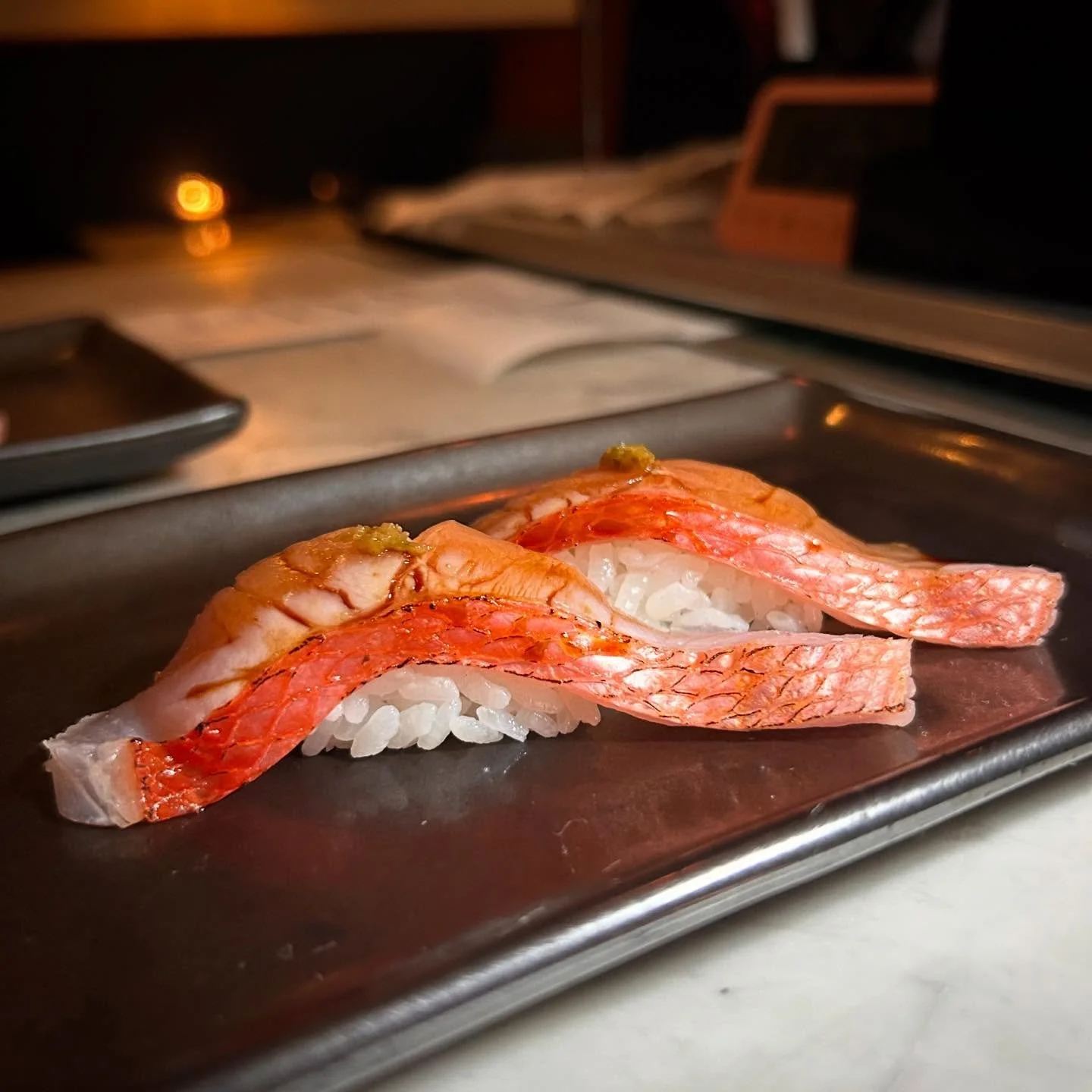 Here is another look at our Kinmedai, or golden eye snapper! Torched and served immediately, this is love at first bite.

#goldeneye #snapper #kinmedai #torched #dinner