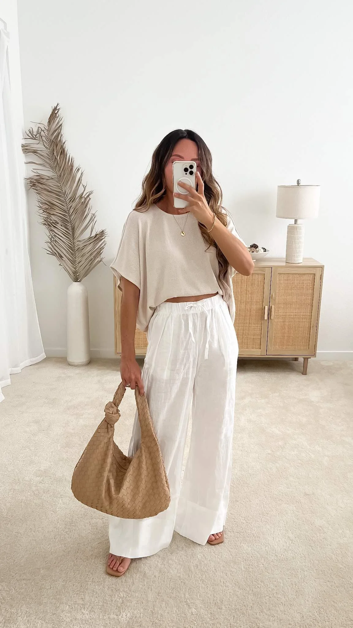 Cute spring outfit with white linen wide-leg pants, relaxed top