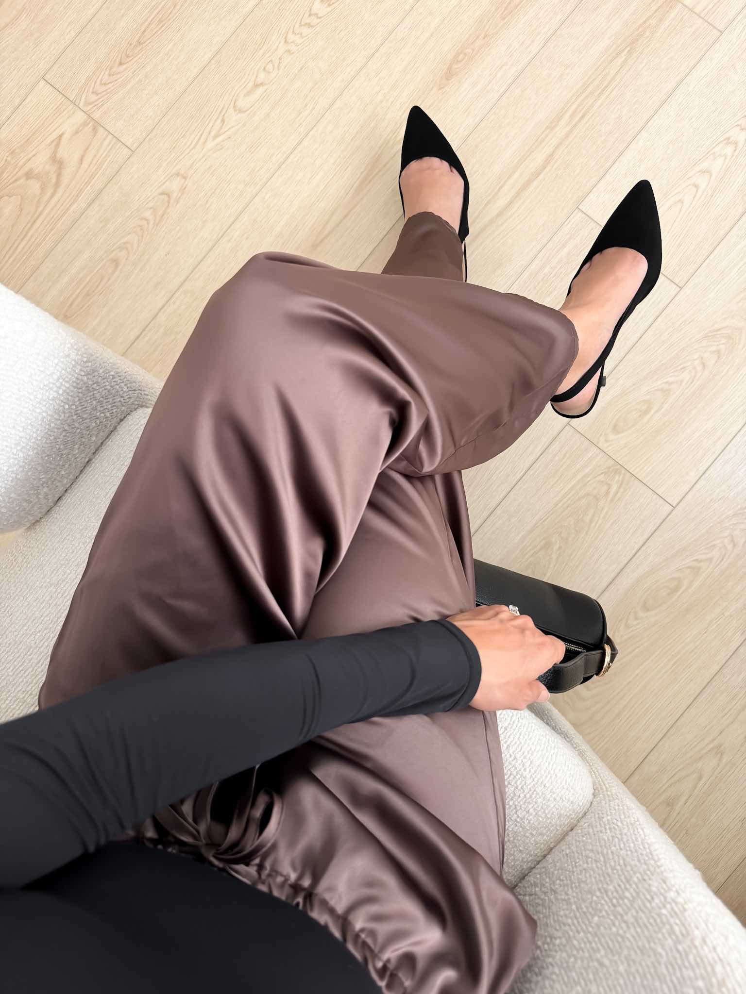 Black slingback heels with satin brown pants outfit and a black top for dressy fall shoe styling