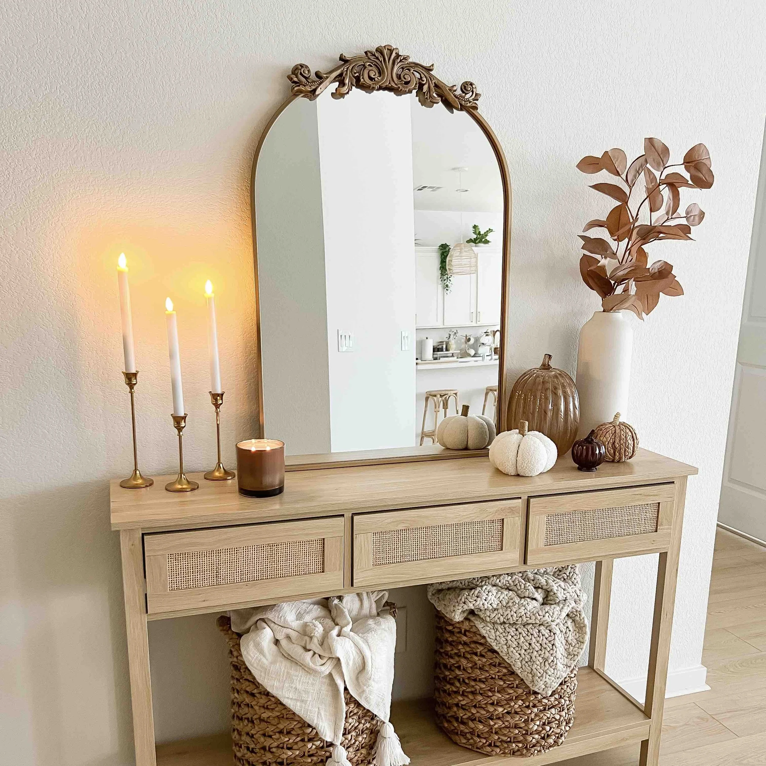  Neutral fall entryway table styling featuring minimalist fall decor in a white hallway 