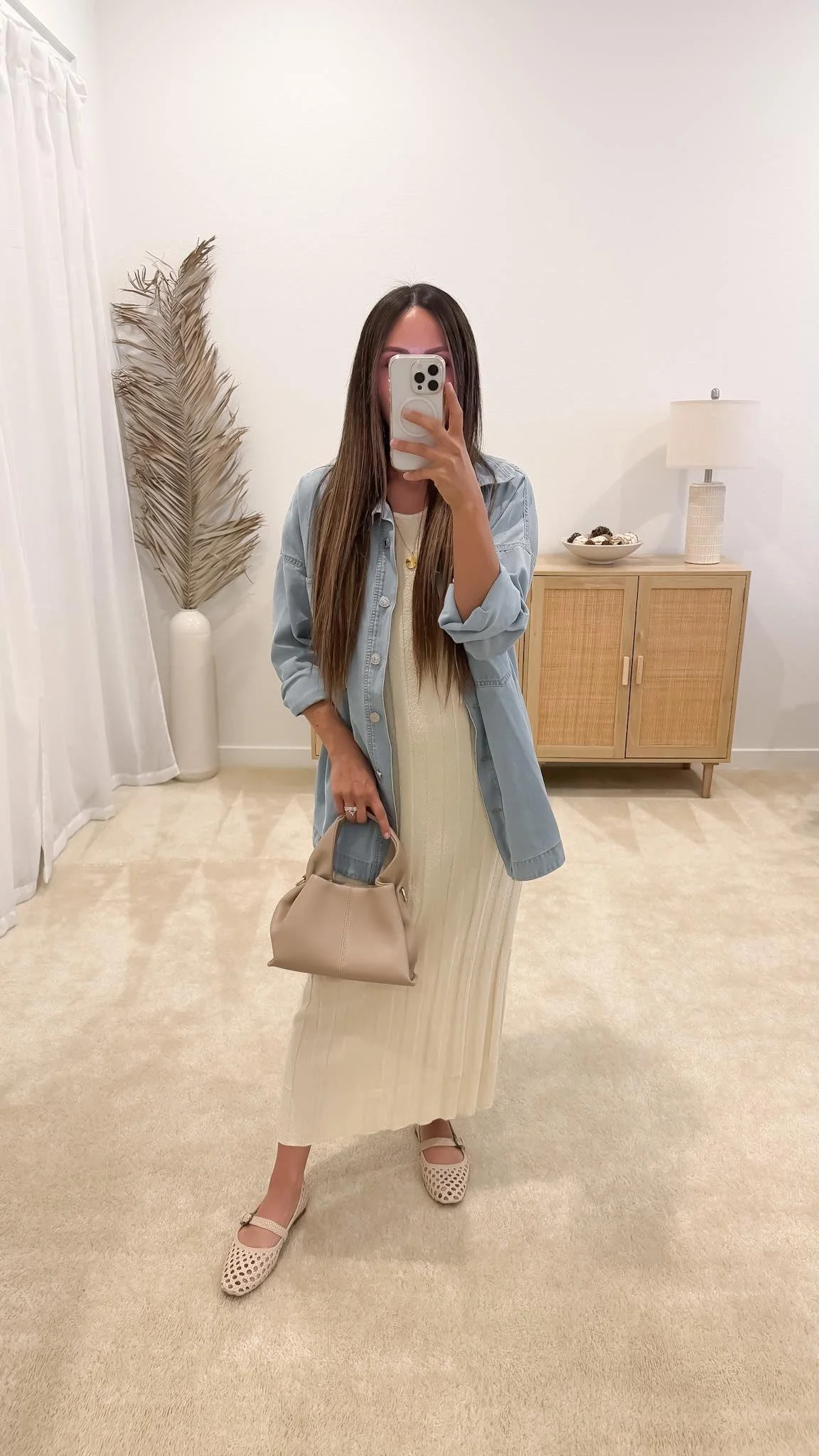 Casual spring outfit with cream midi dress, chambray shirt, flats