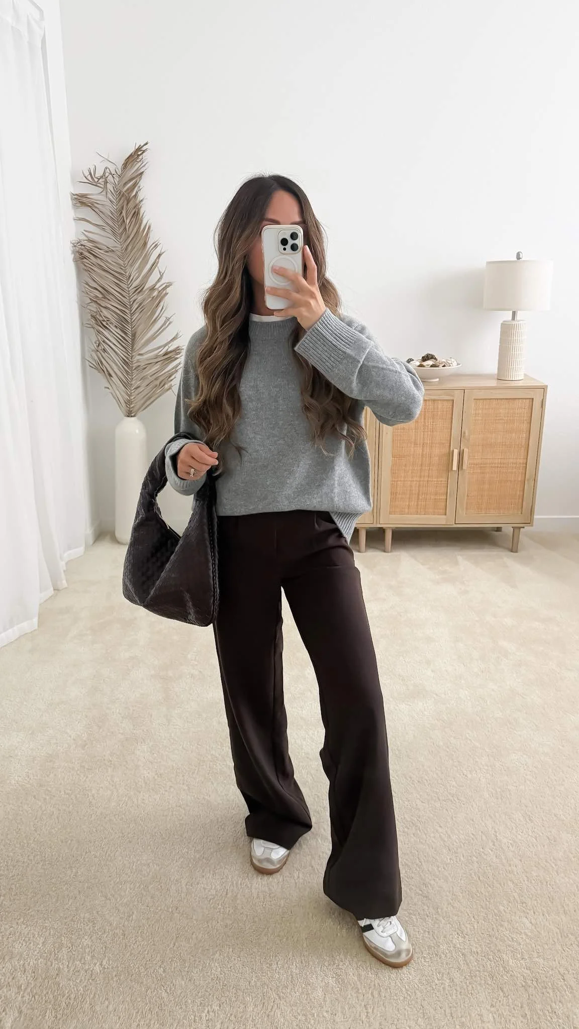 Sweater with trousers outfit featuring Quince Mongolian Cashmere Oversized Crewneck Sweater styled with brown pants and sneakers