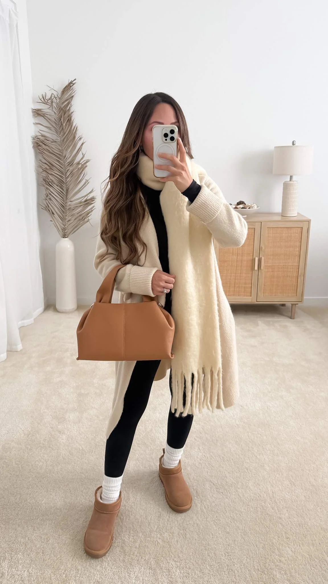 Cozy fall outfit with long cardigan, black leggings, scarf and UGG boots