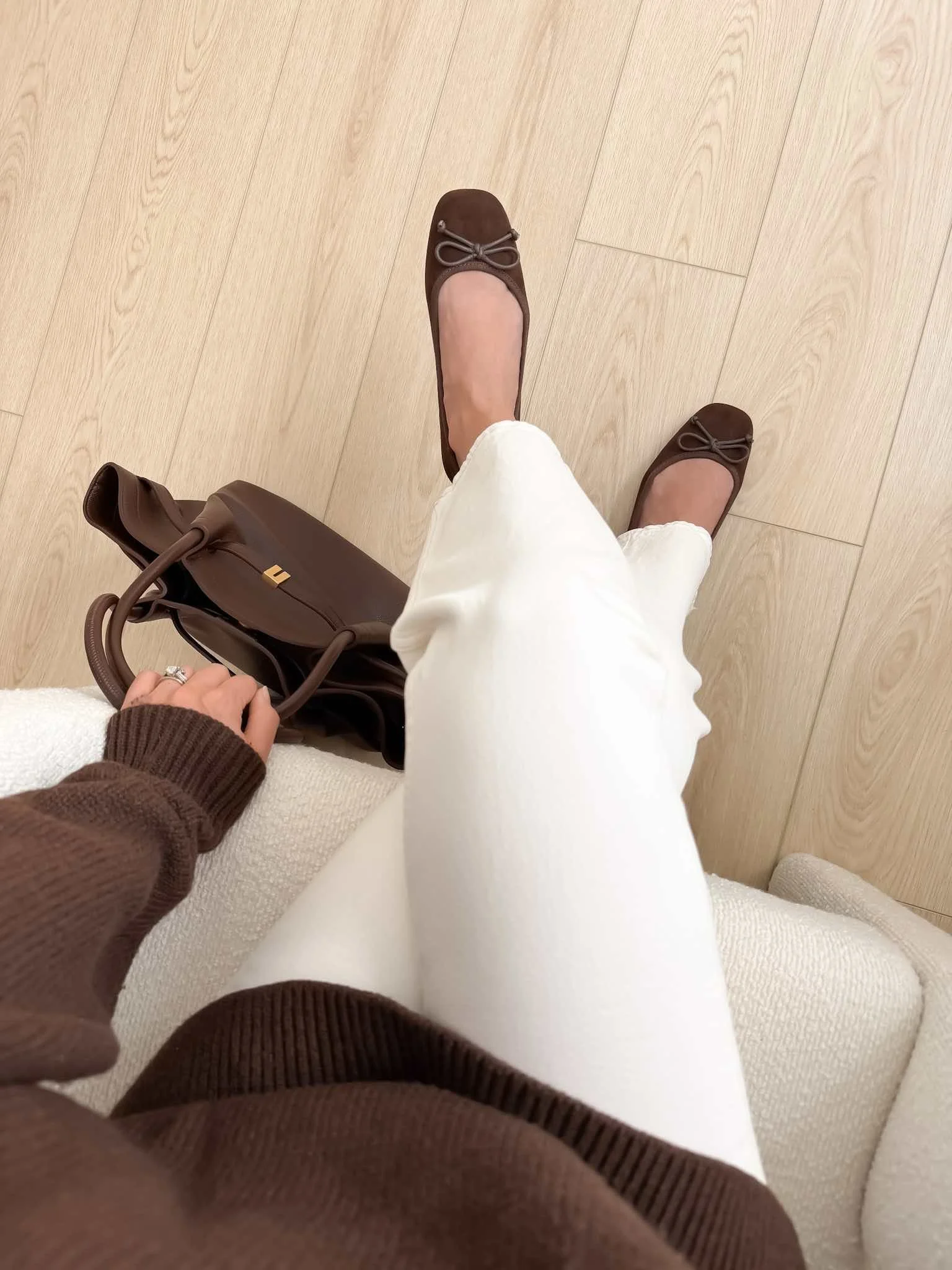 Brown ballet flats outfit with white jeans and brown sweater for effortless fall shoe styling
