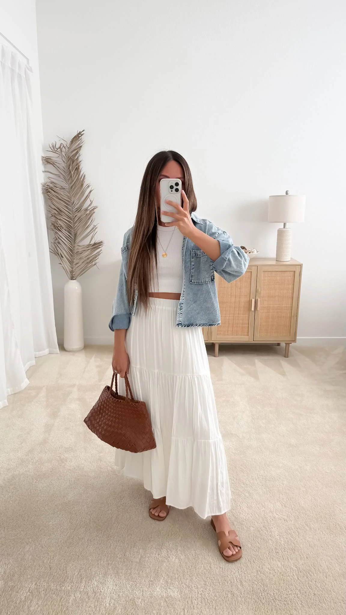 Cute spring outfit with white tiered maxi skirt, denim jacket