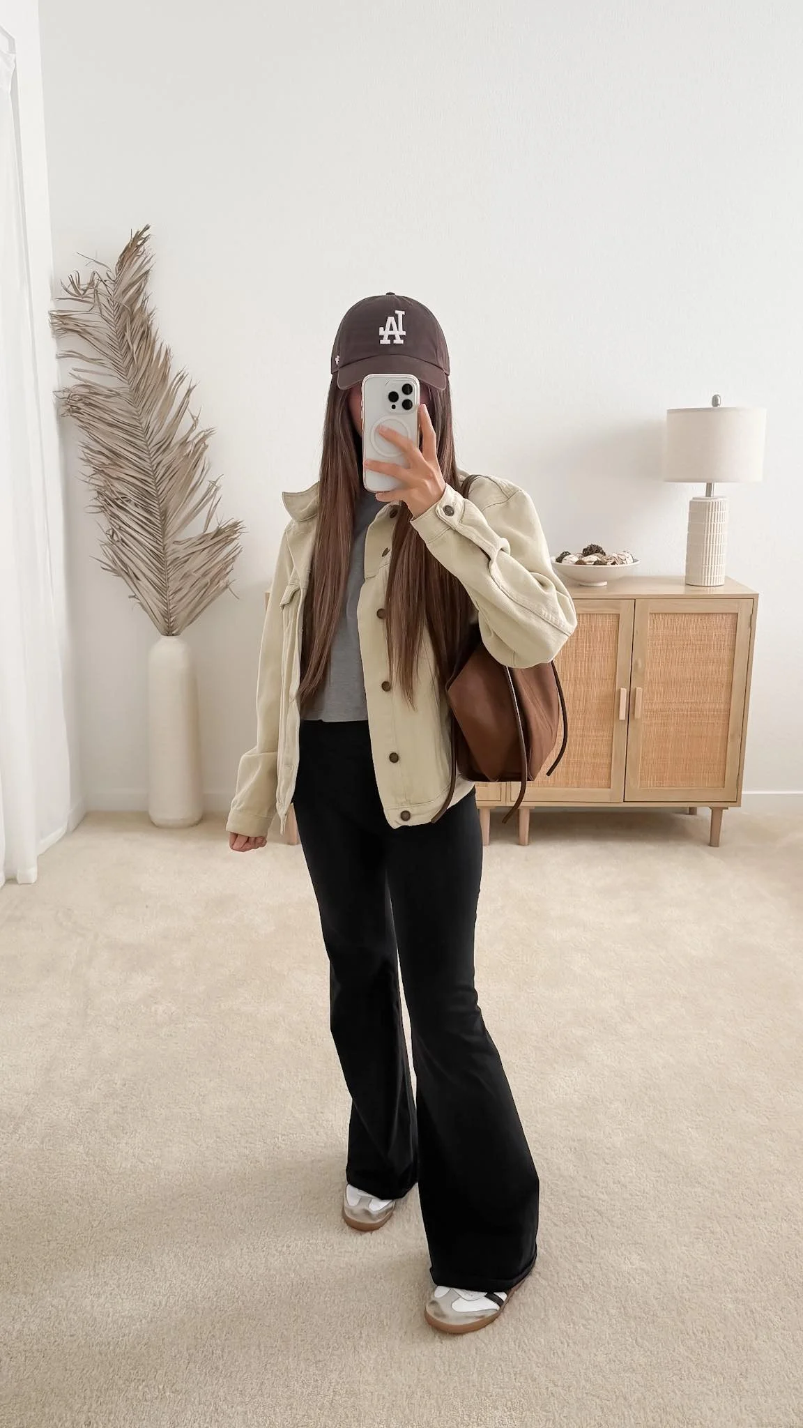 Casual spring outfit with flared leggings, utility jacket, sneakers