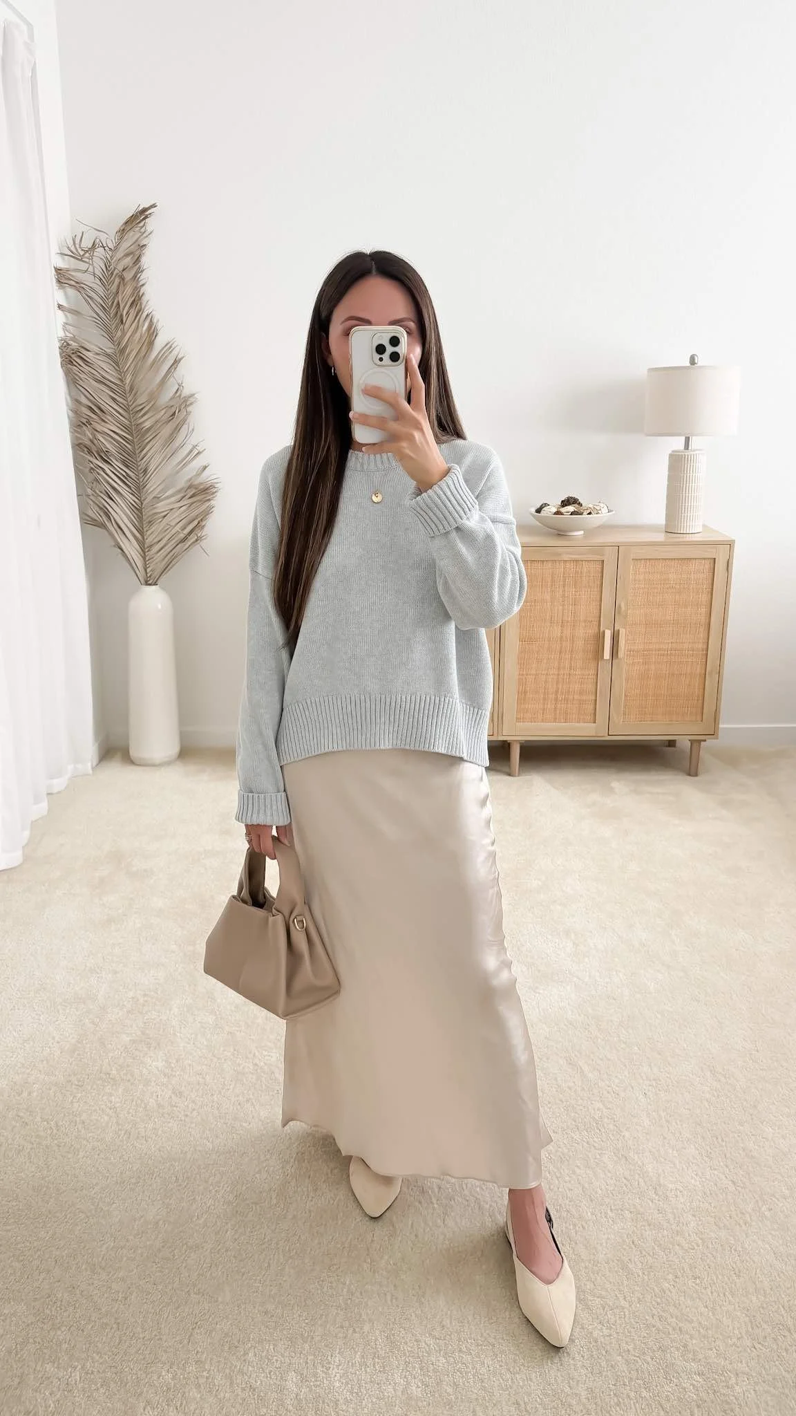 Sweater with satin skirt outfit featuring Quince Organic Cotton Boyfriend Crew Sweater styled with a champagne satin maxi skirt and beige suede slingback flats
