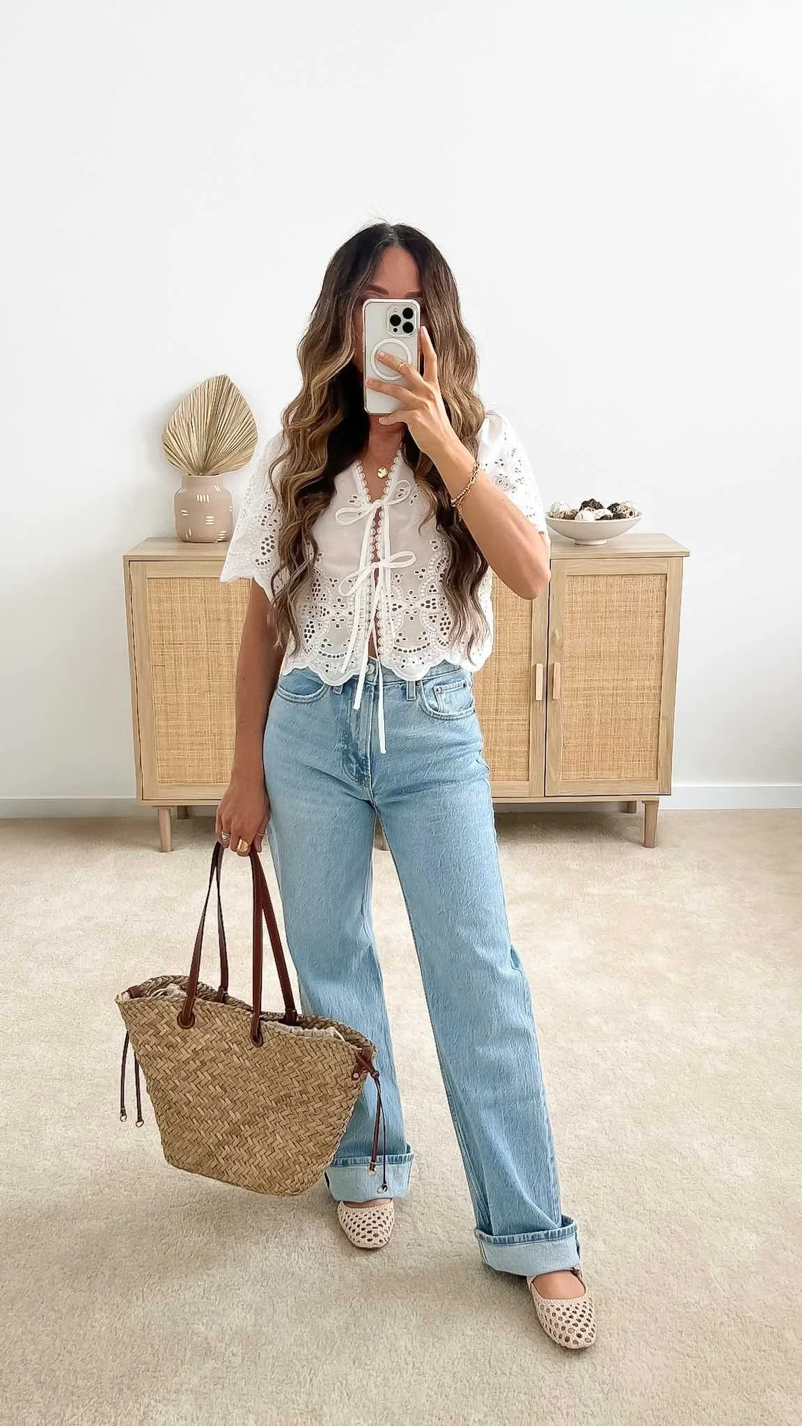 Cute spring outfit ideas with eyelet tie-front top, light wash jeans