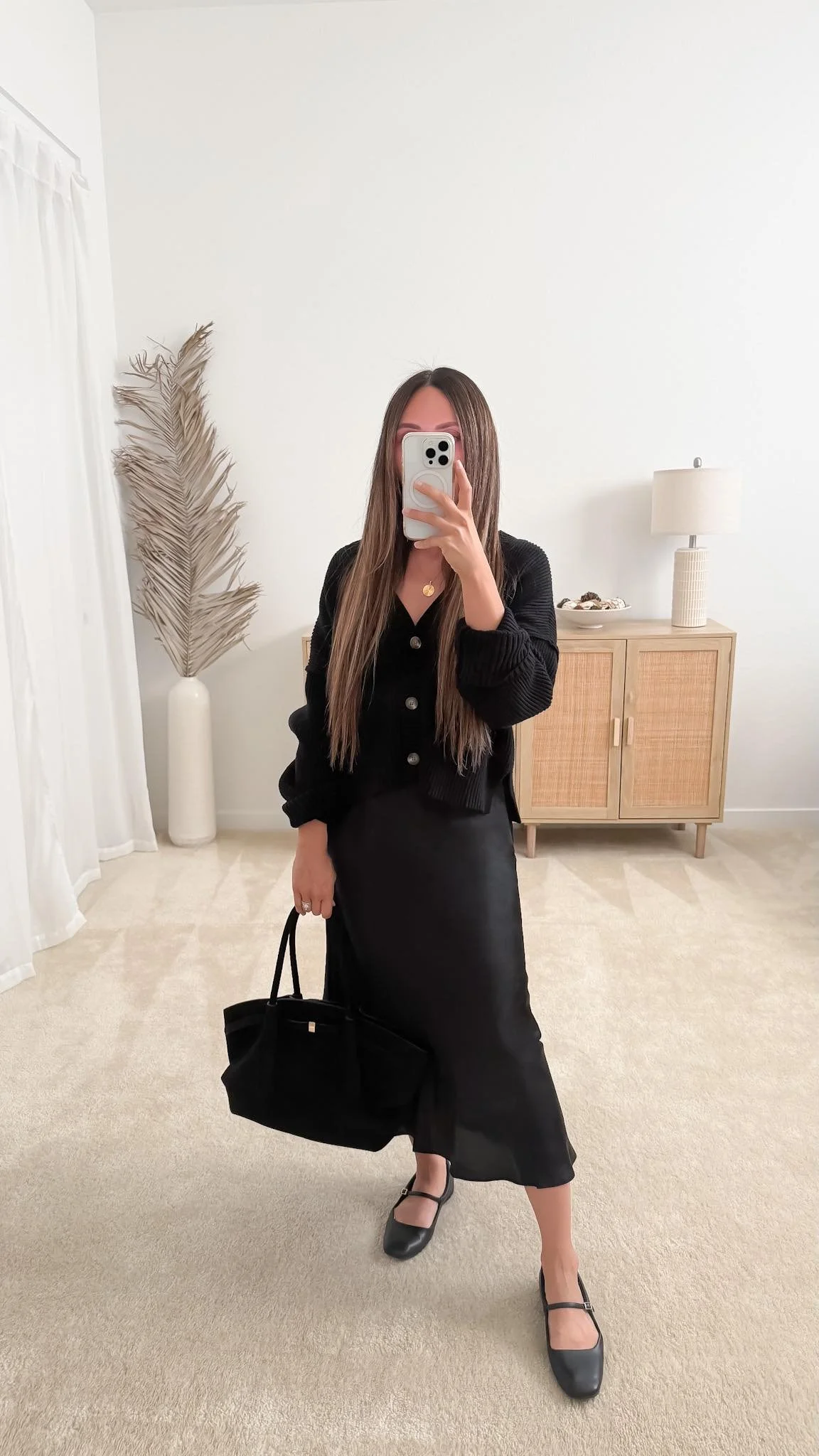 Cute spring outfit with black satin midi skirt, cardigan