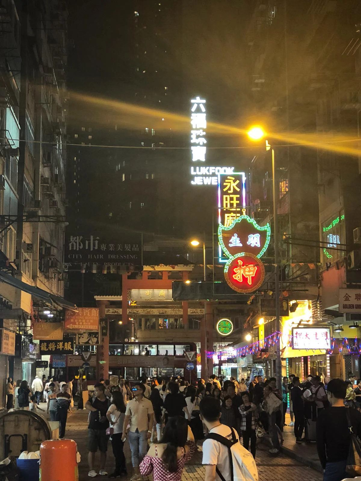 Nighttime in Kowloon is lively. Shops and restaurants are packed, and everyone is out enjoying themselves.