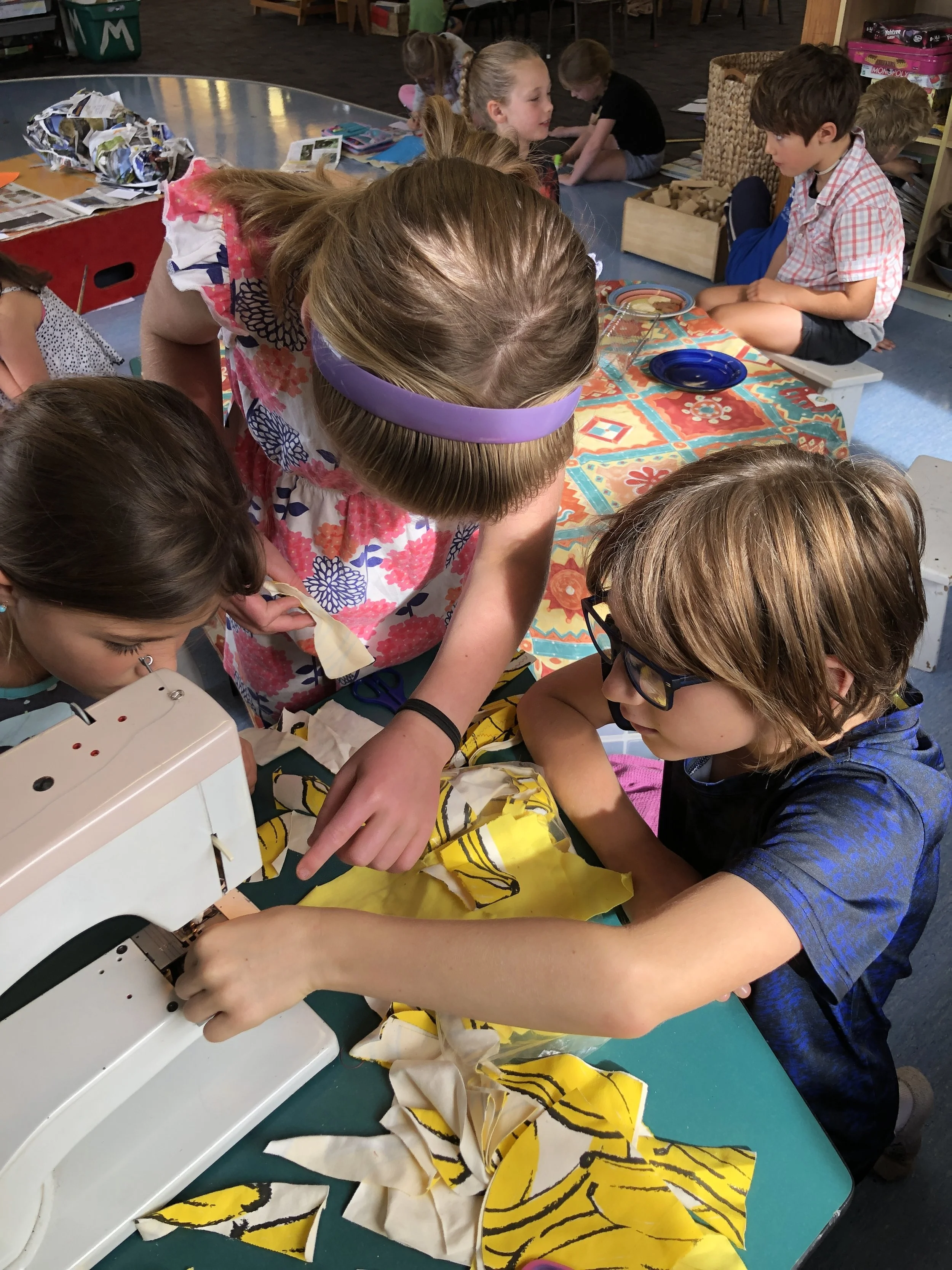 Sewing in Kahikatea classroom with fabric scraps from our partners at Thunderpants