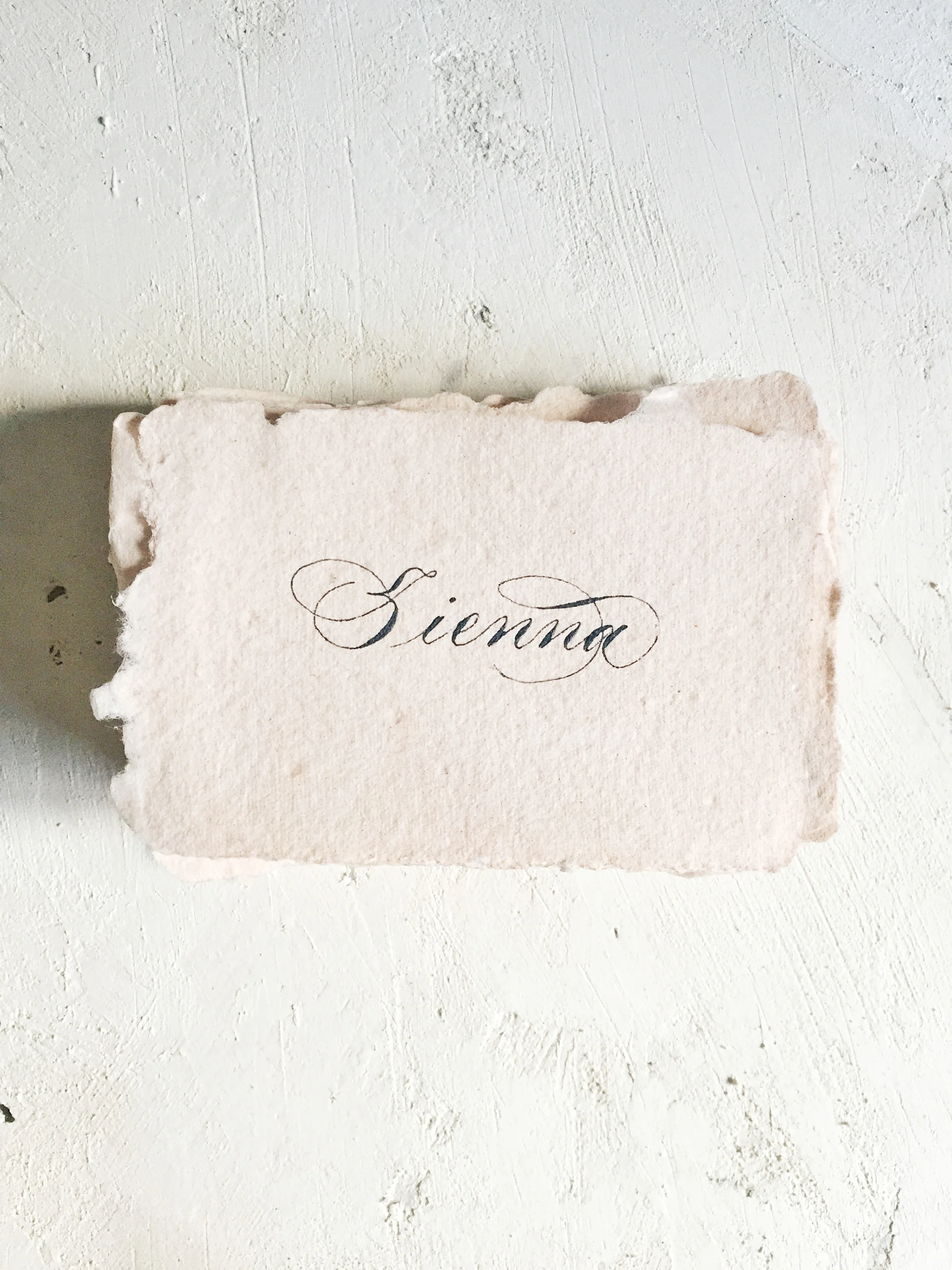 Classic copperplate on peach handmade paper
