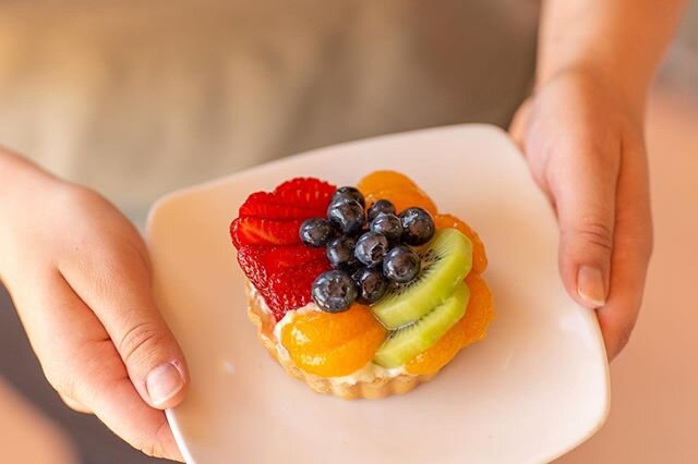 Fresh glazed fruit, placed in a creamy custard and cradled by flaky pastry... yummm