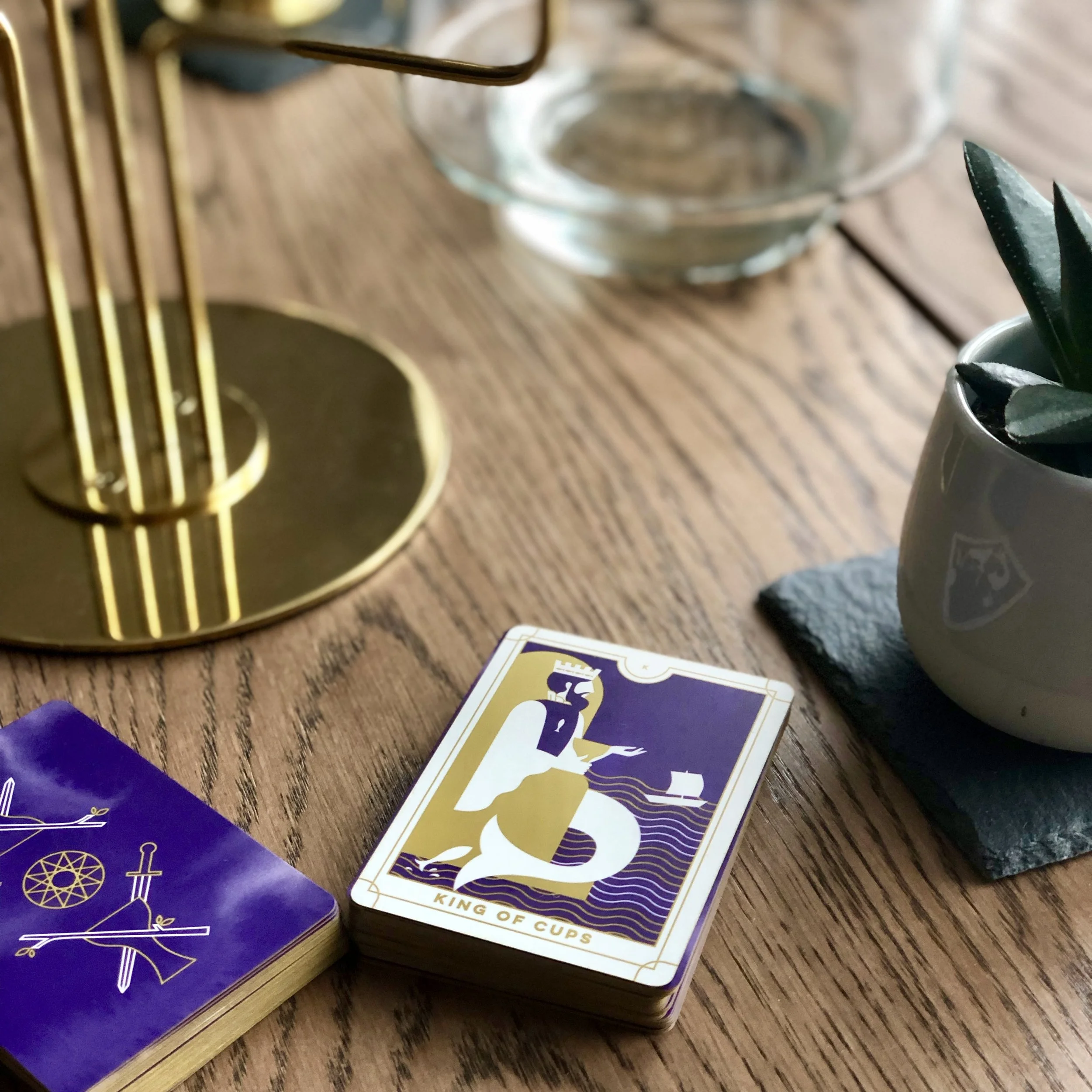 It’s cards like the King of Cups that make me appreciate the stripped-down version of Smith’s original illustrations, removing some of the Renaissance nonsense.