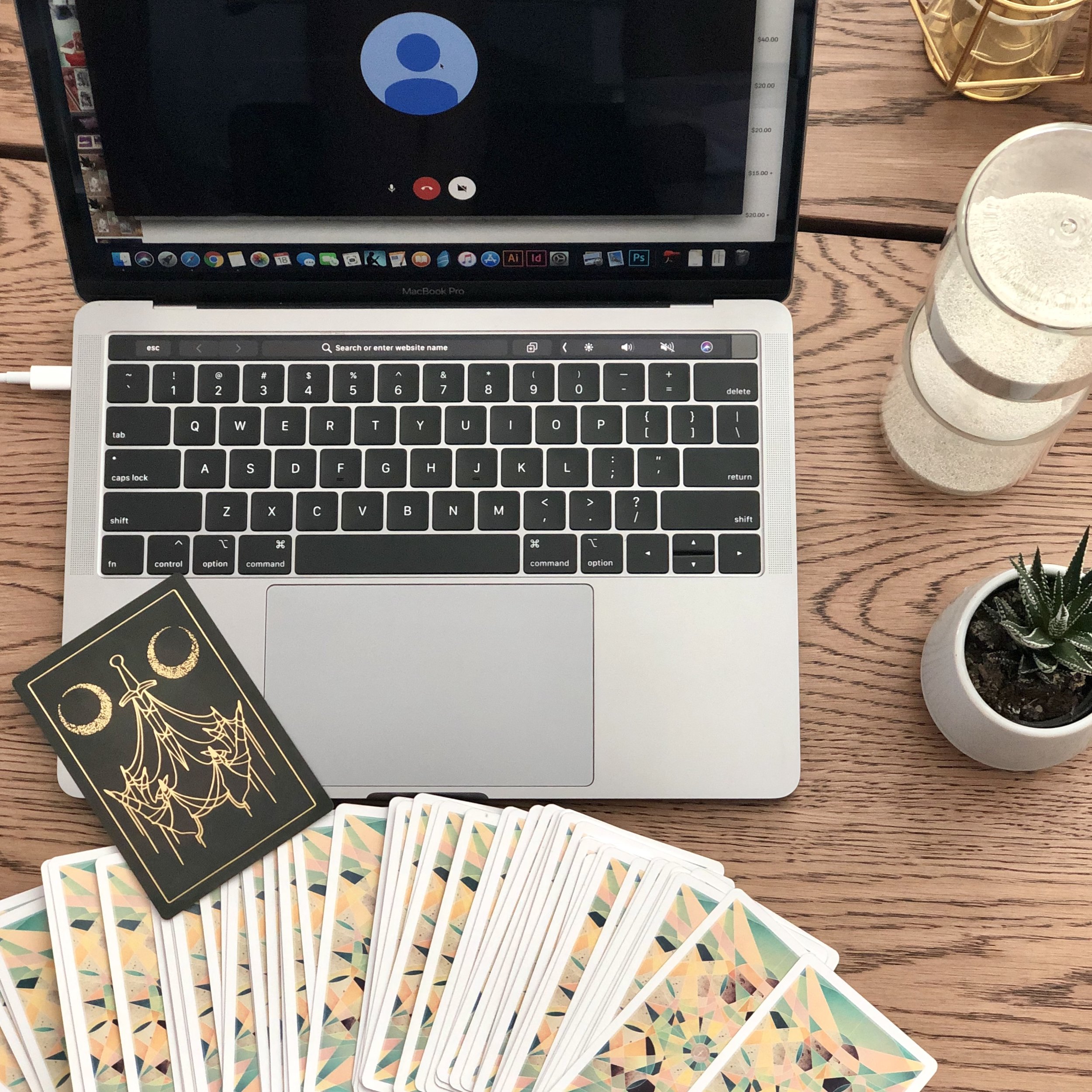 The deck pictured here is the Fountain Tarot, published by Roost Books. And the lone card up top is from the Threads of Fate , an independently published divinatory deck for connecting with your spirit guides through archetypes and common lessons.