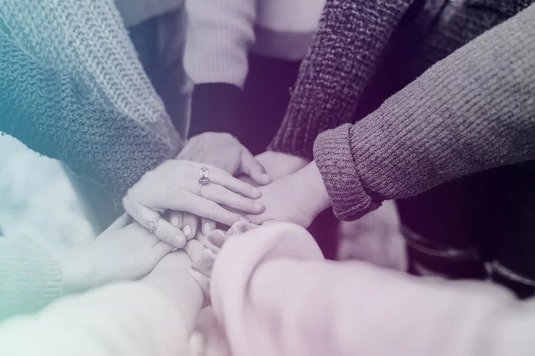 Group of Hands Coming Together