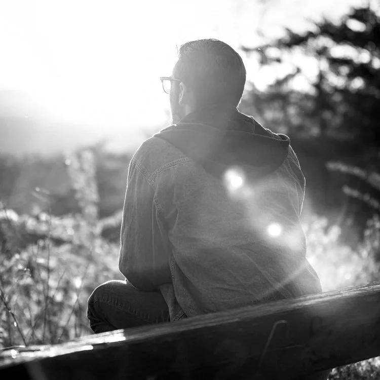 Male Therapy Client Sitting Pensively