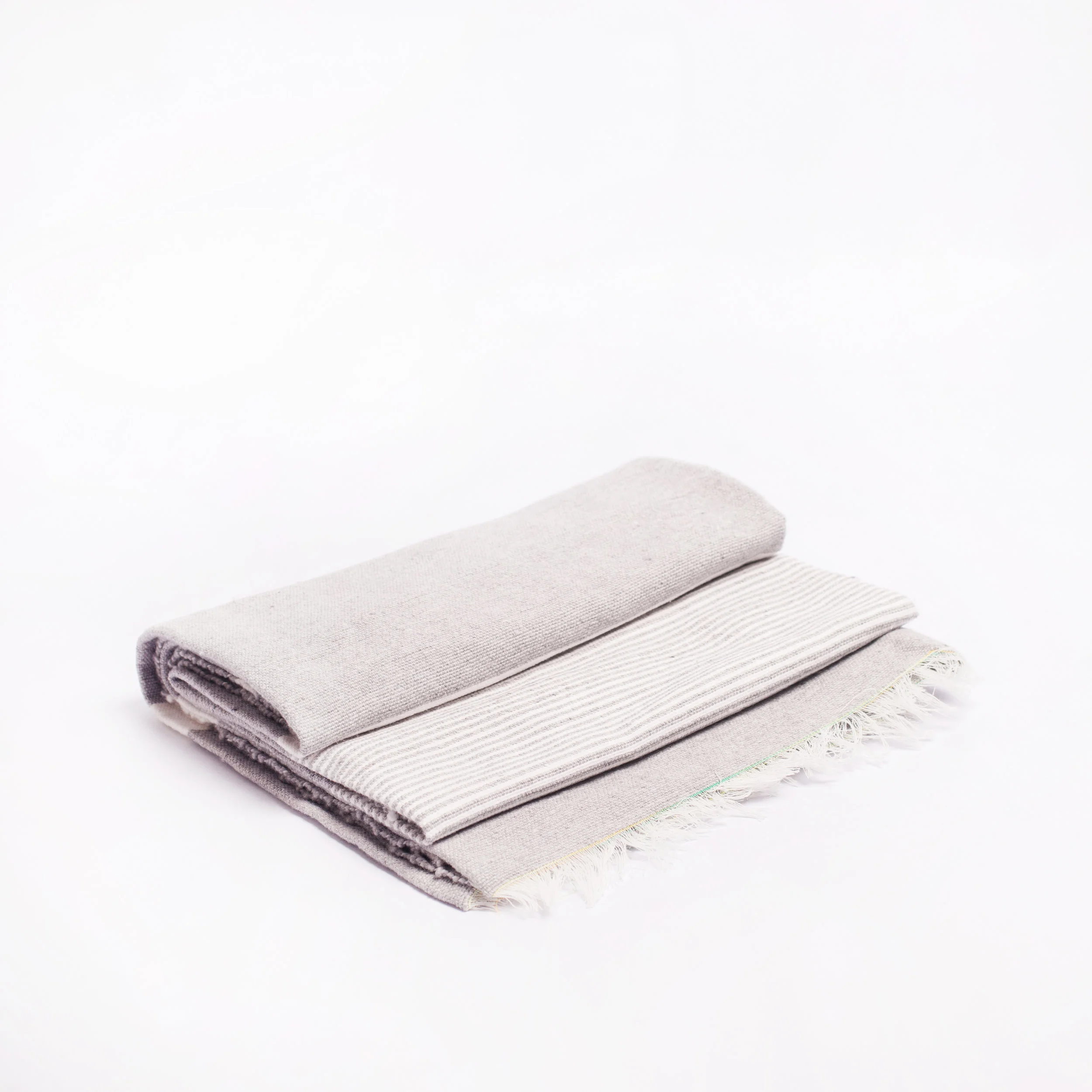 Grey blanket with white stripes
