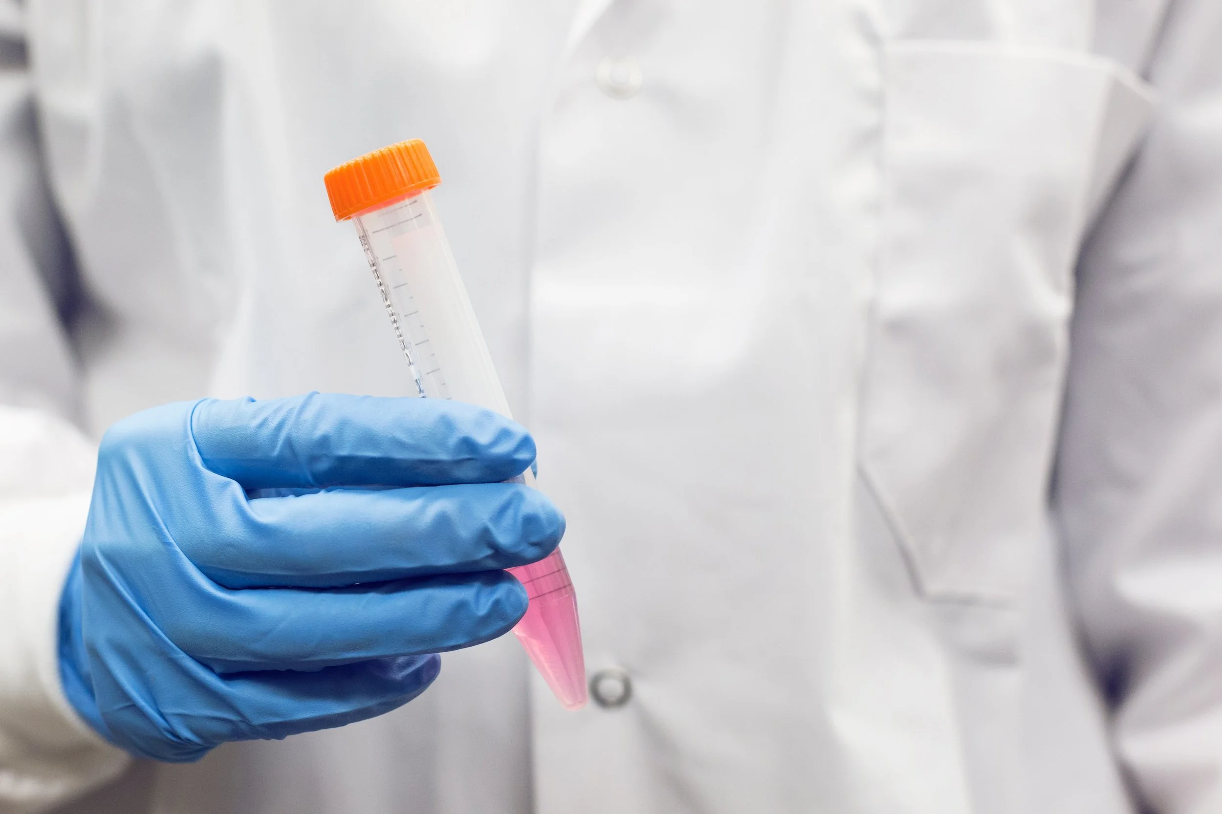 gloved-hand-and-test-tube_4460x4460.jpg