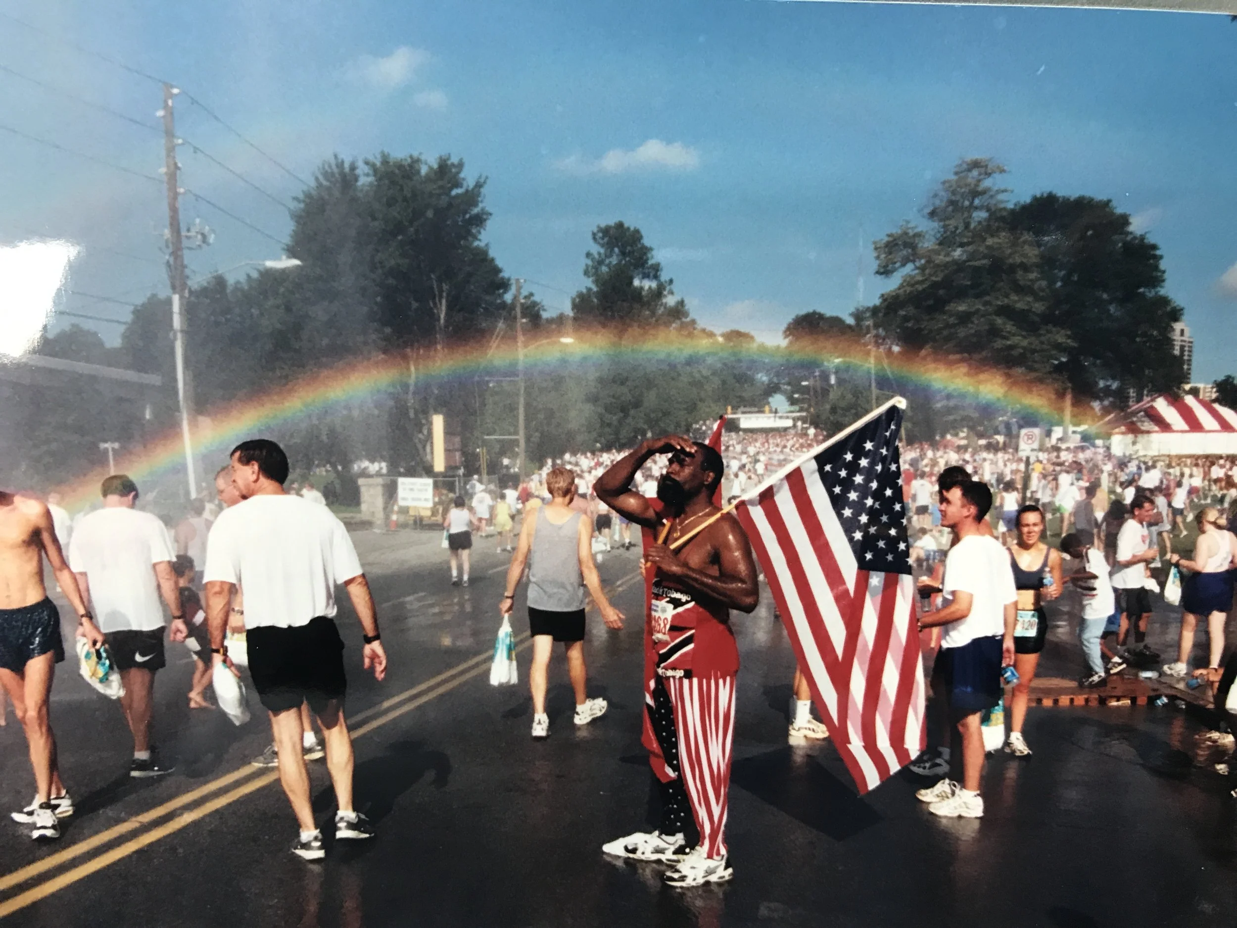 A rainbow perfectly arches over 10th Street in 1999, the first year the race finished there. 