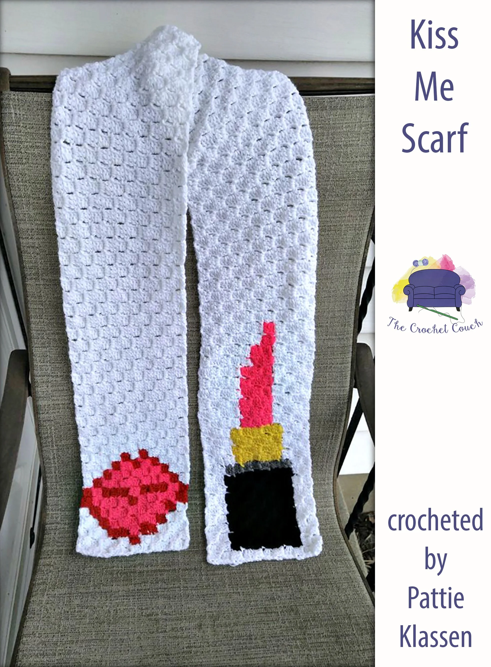 Scarf is draped over a chair - it is called the Kiss Me Scarf and has a white background with lips on one side and lipstick on the other side.  This was crocheted by Pattie Klassen