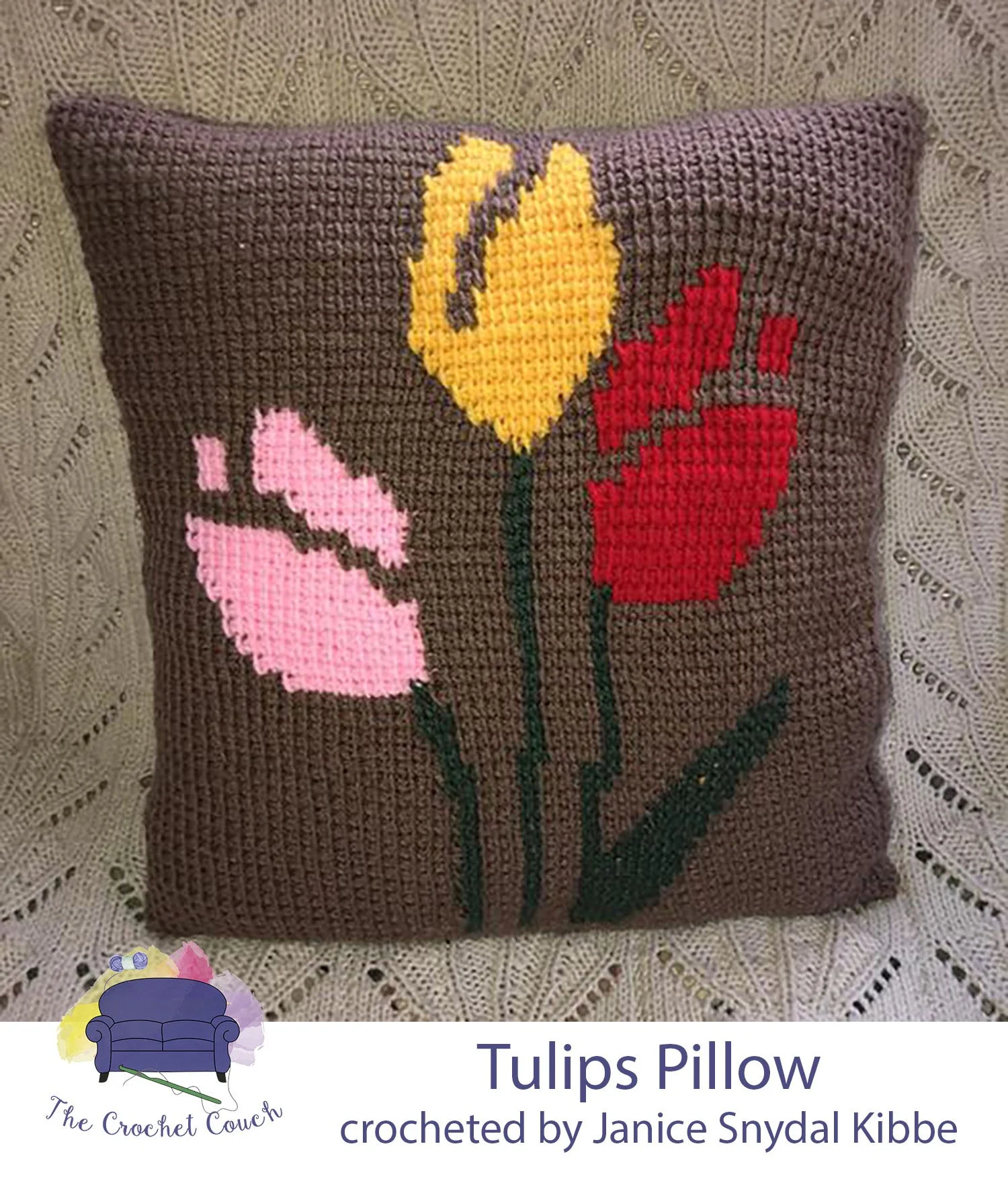 Crocheted pillow done in tunisian simple stitch (tss) has a cocoa background with tulips done in pink, red and yellow.  Tulip pillow crocheted by Janice Snydal Kibbe