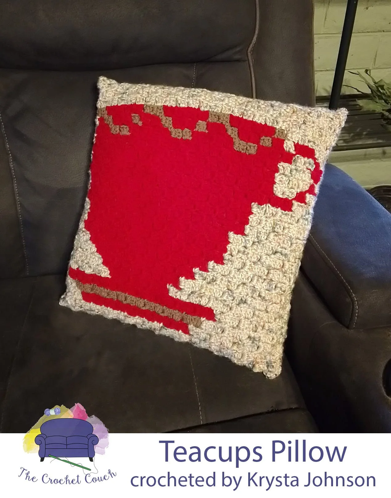 Crocheted pillow done in C2C and shown on recliner - pillow has a red teacup on it with an off-white background.  Pillow was crocheted by Krysta Johnson