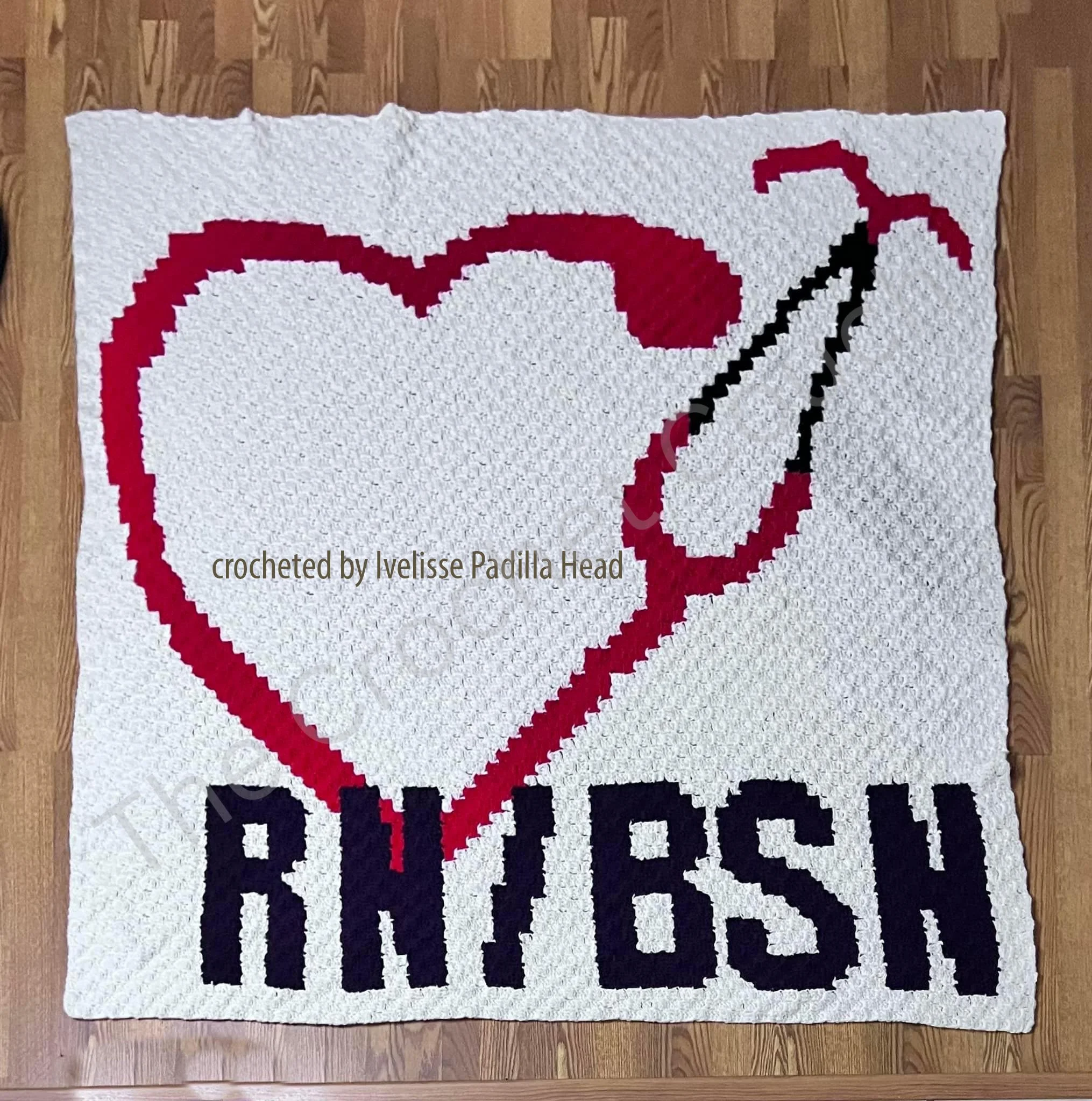 Crochet afghan featuring a large red heart intertwined with a stethoscope and "RN/BSN" lettering at the bottom, made in corner-to-corner (C2C) crochet.