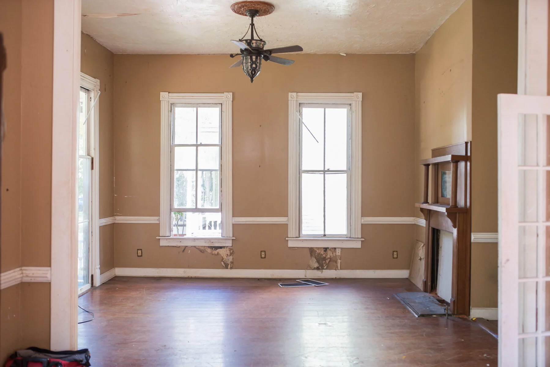 This is the room directly to the left when you walk in. We’ll replace this opening with the original wall that was there, with french doors and a transom above. We’ll use this as the playroom until the kids are older, when it will become more of a formal living space.