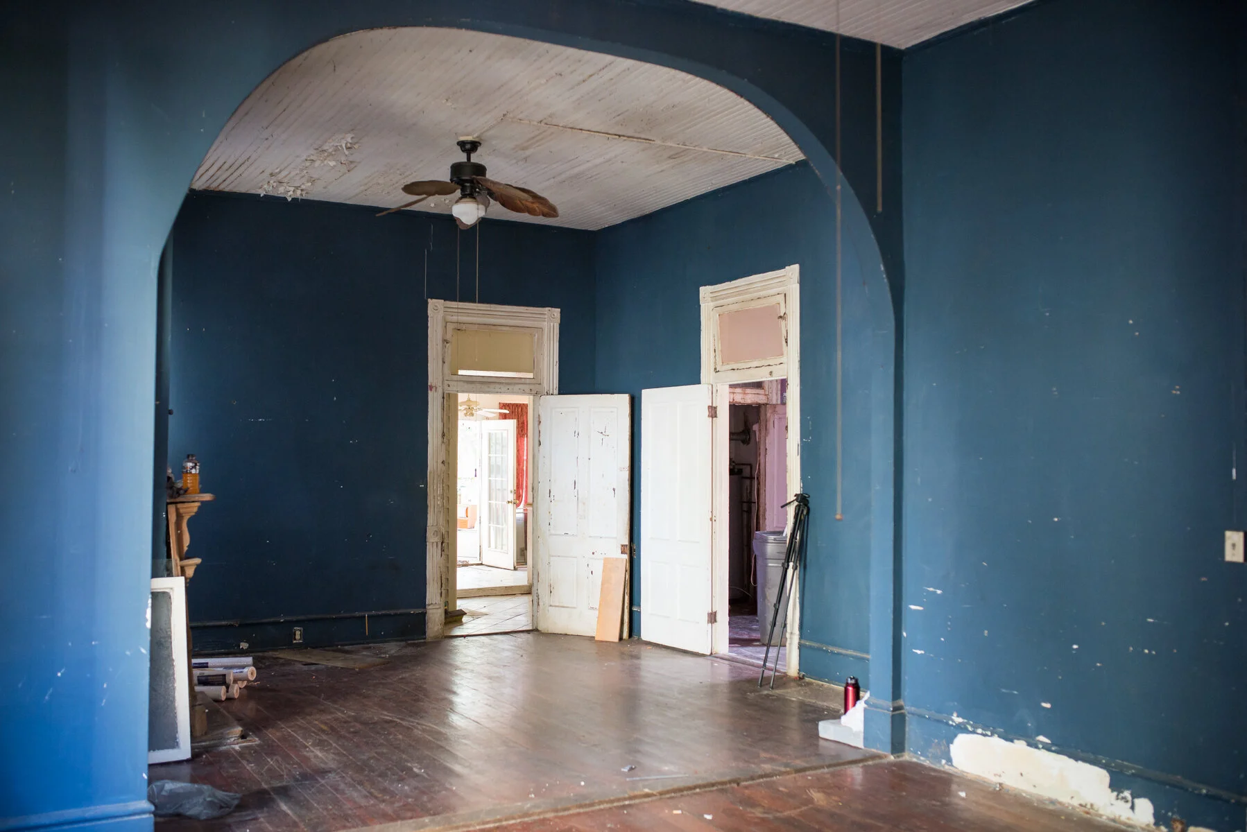 This (and the photo below) are of the main living space. We’ll take down most of the wall on the right (while keeping the arch) to create a more open plan. Behind the door on the left is where the kitchen will be.