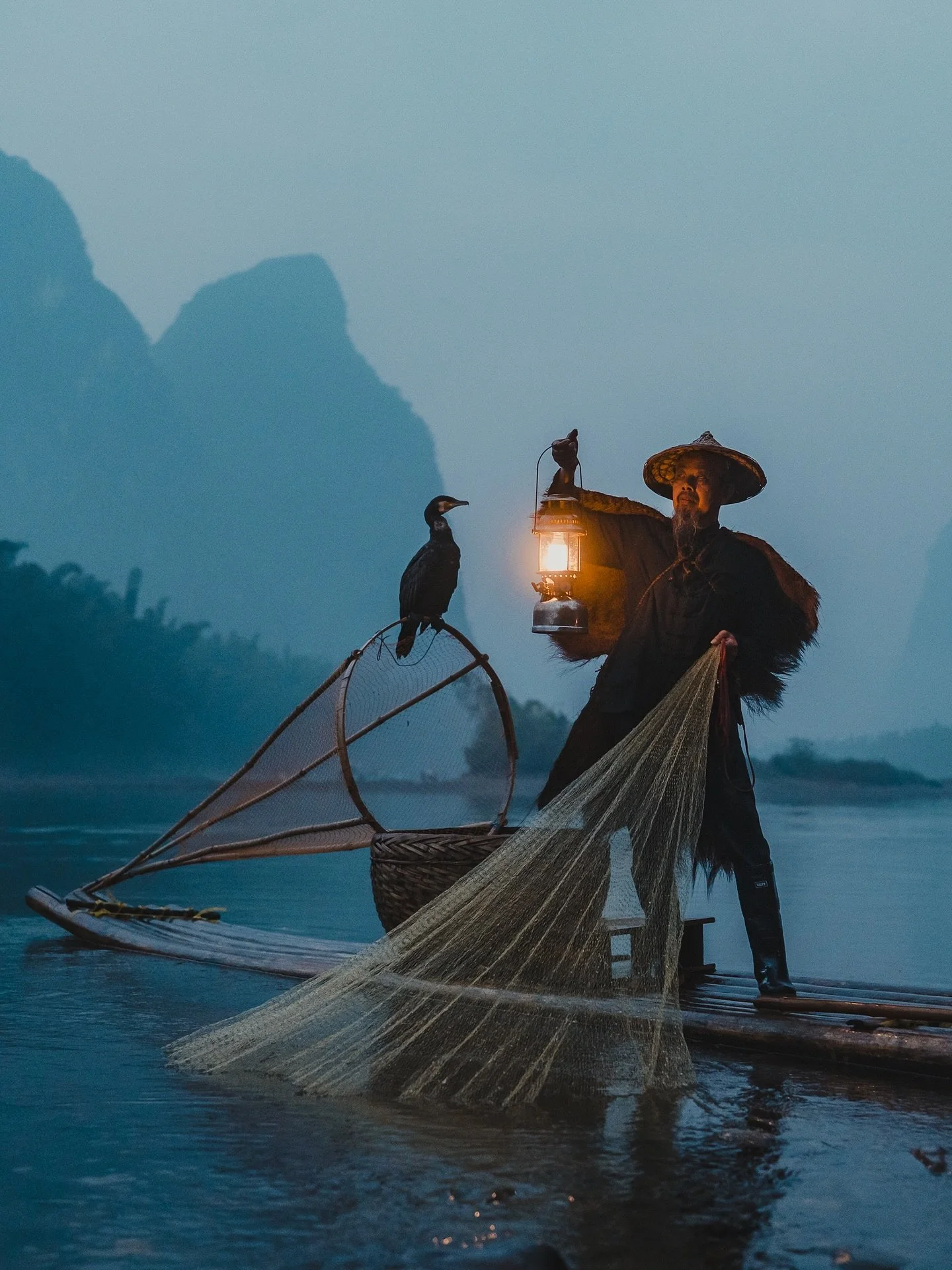 Probably my favourite image that I captured of the iconic Cormorant fishermen in Guilin, China. I love the cinematic blue hour vibes, the contrast of the lamp, and positioning of all the elements. Once a common fishing method, it’s now mostly a