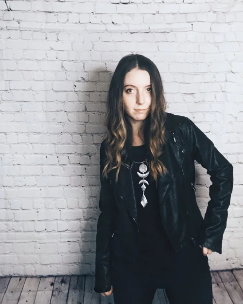 Black shirt, black jeans, black leather jacket, and a statement necklace. Easy and comfortable.