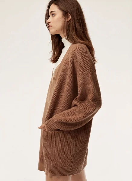 Wilfred Free Rourke Sweater @ Aritzia I actually own this sweater in black and can tell you from experience that it's worth the price tag. The fabric is amazing and high-quality, and it's basically the perfect slouchy sweater that will stick with you for years.