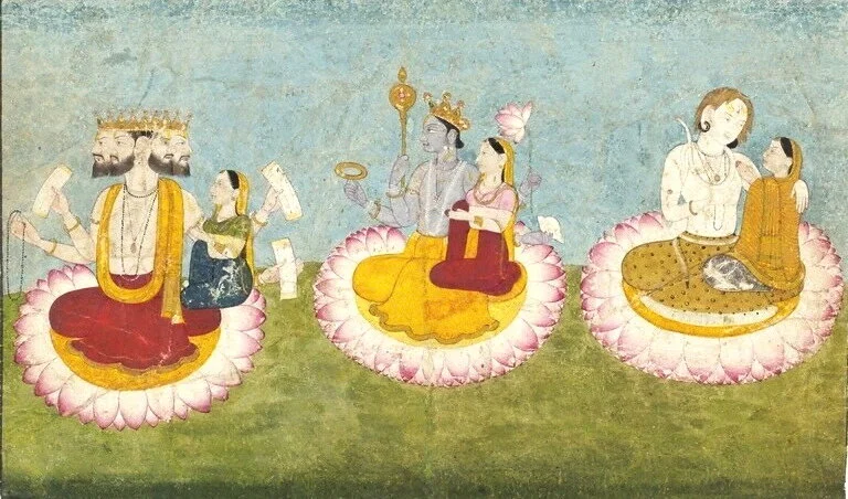 Brahma, Vishnu and Shiva seated on lotuses with their consorts, Saraswati, Lakshmi and Paravati respectively. ca 1770. Guler, India. Source: Wikipedia