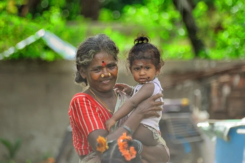 A grandmother with granddaughter, India. Image Credits : Nithi Anand, Flickr