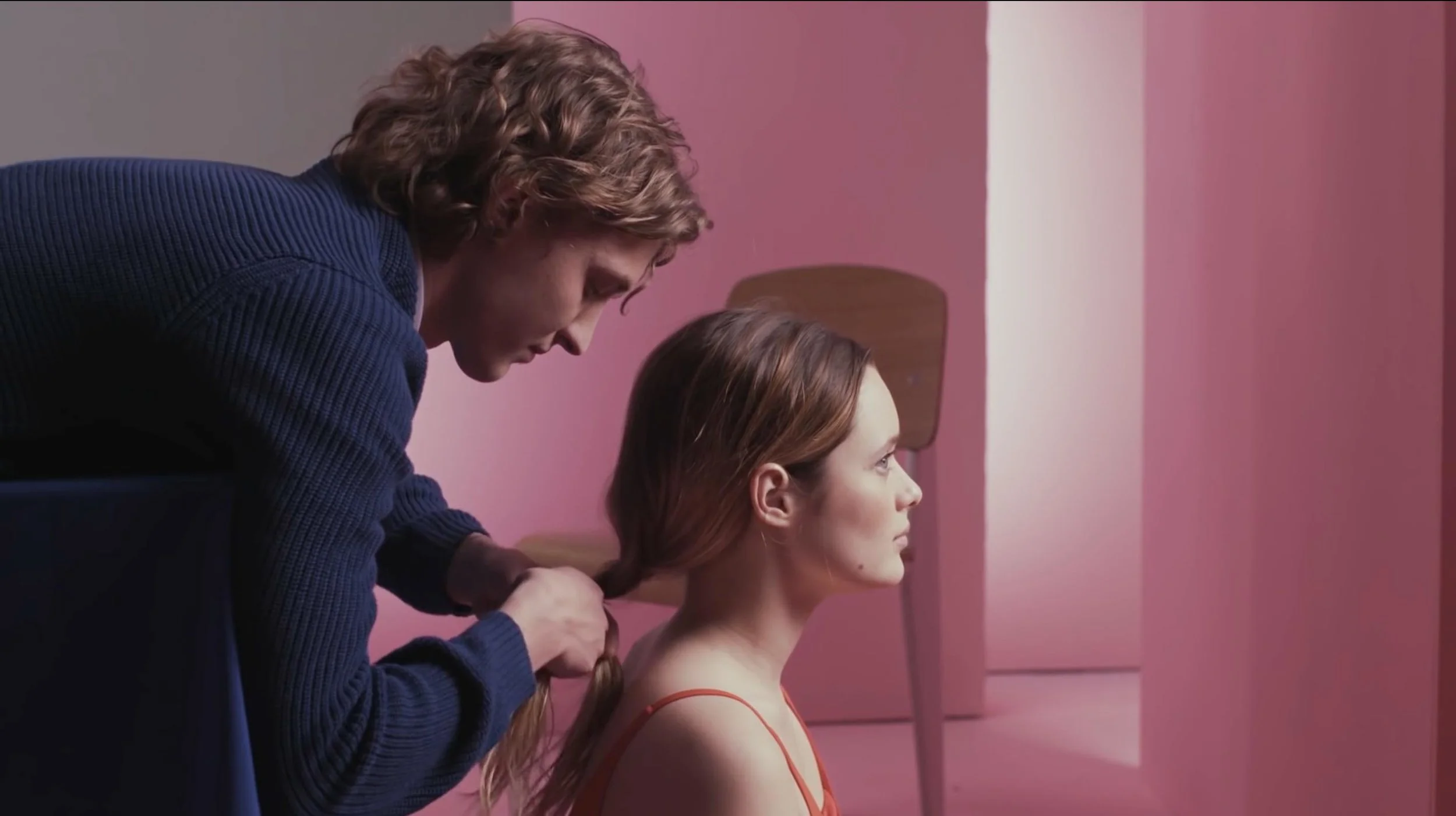 pink wall dimension-woman and man- daydreaming minimal set-up.