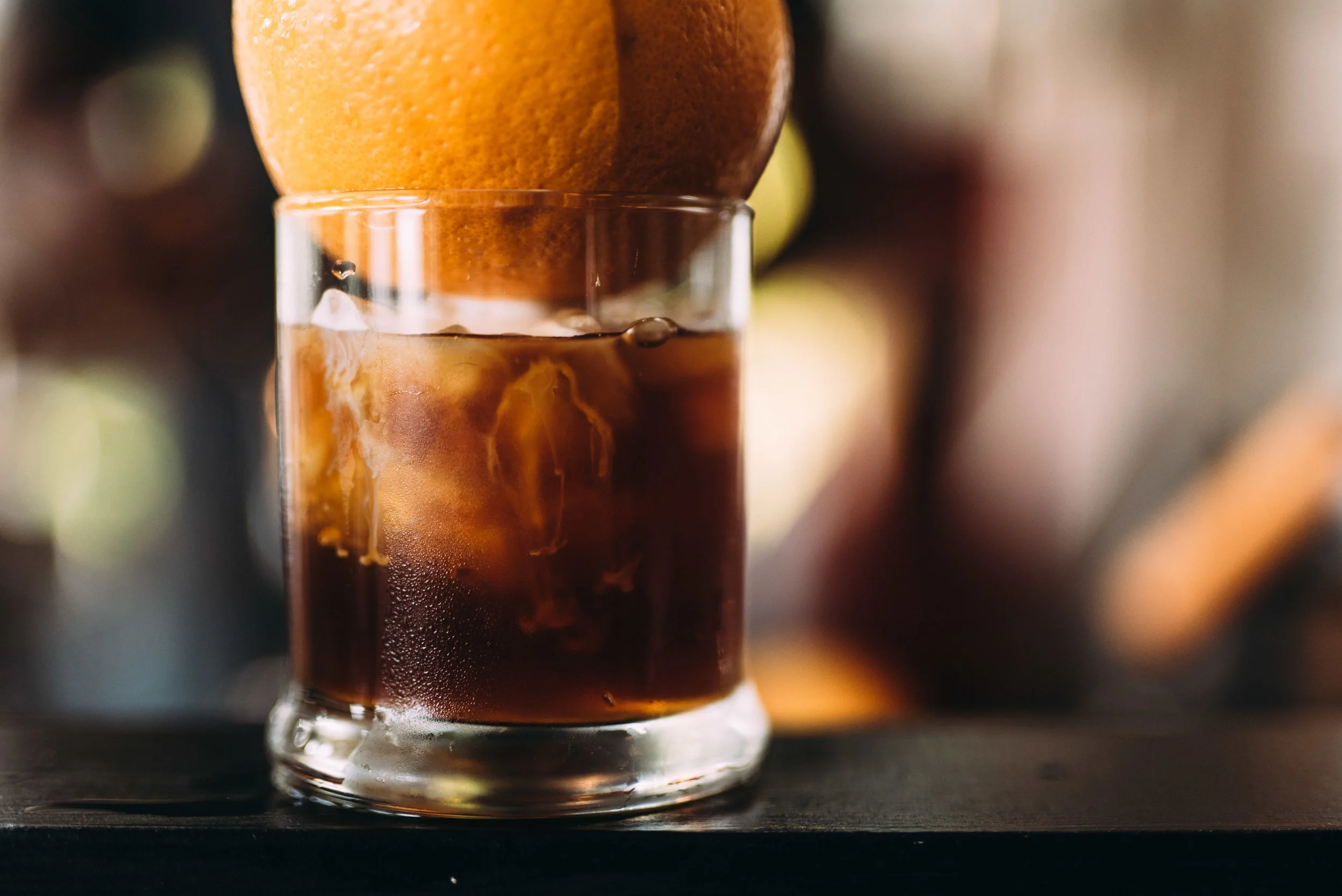 Gilbert The Gilbert snatches it’s influence from the most traditional cocktail roots. The Old Fashioned. The blend of fizzy citrus and smooth cold brew will melt you into an introspective daze. It may only be an 8oz drink, but it’s full of subtle complexity and bold flavor. The fusion of sugars, bitters, and coffee make for a strong yet stimulating beverage. Definitely a man’s man kind of drink. Sit down with a Gilbert and slip into some contemplative reflection.