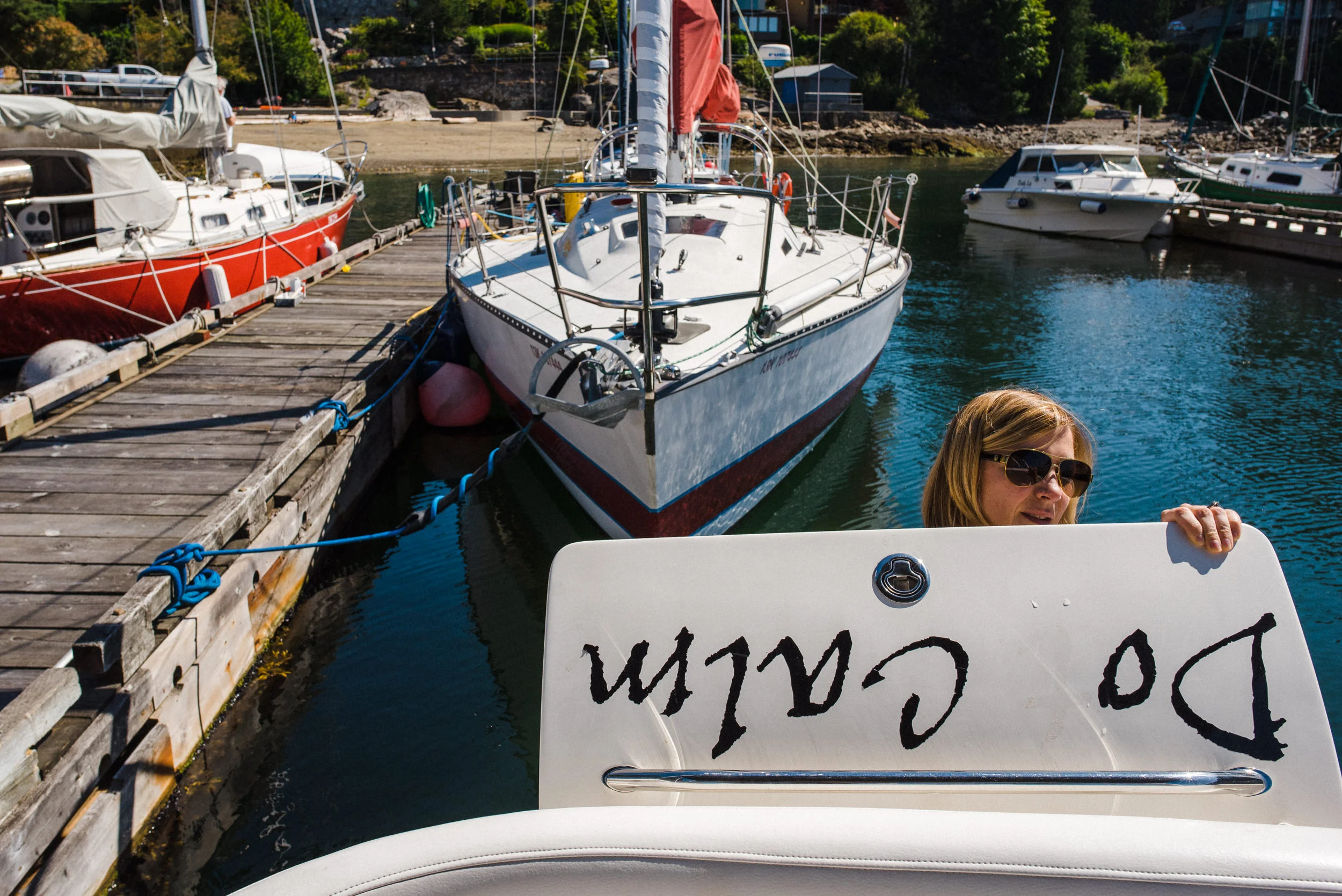 woman preparing boat for launch at dock
