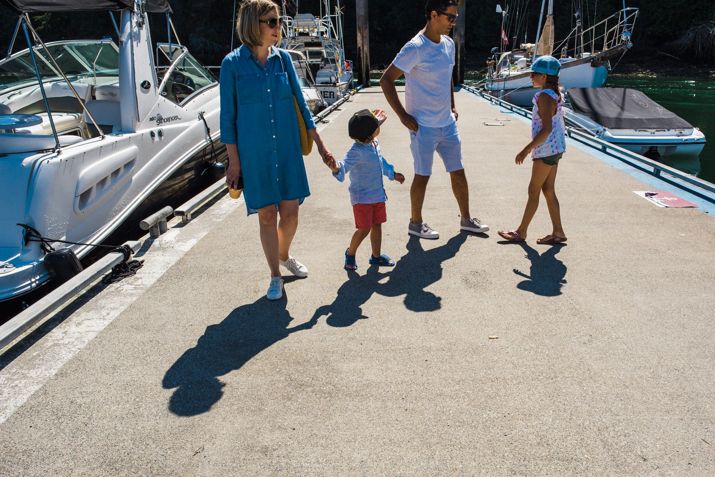 family walking together on the dock on Bowen Island
