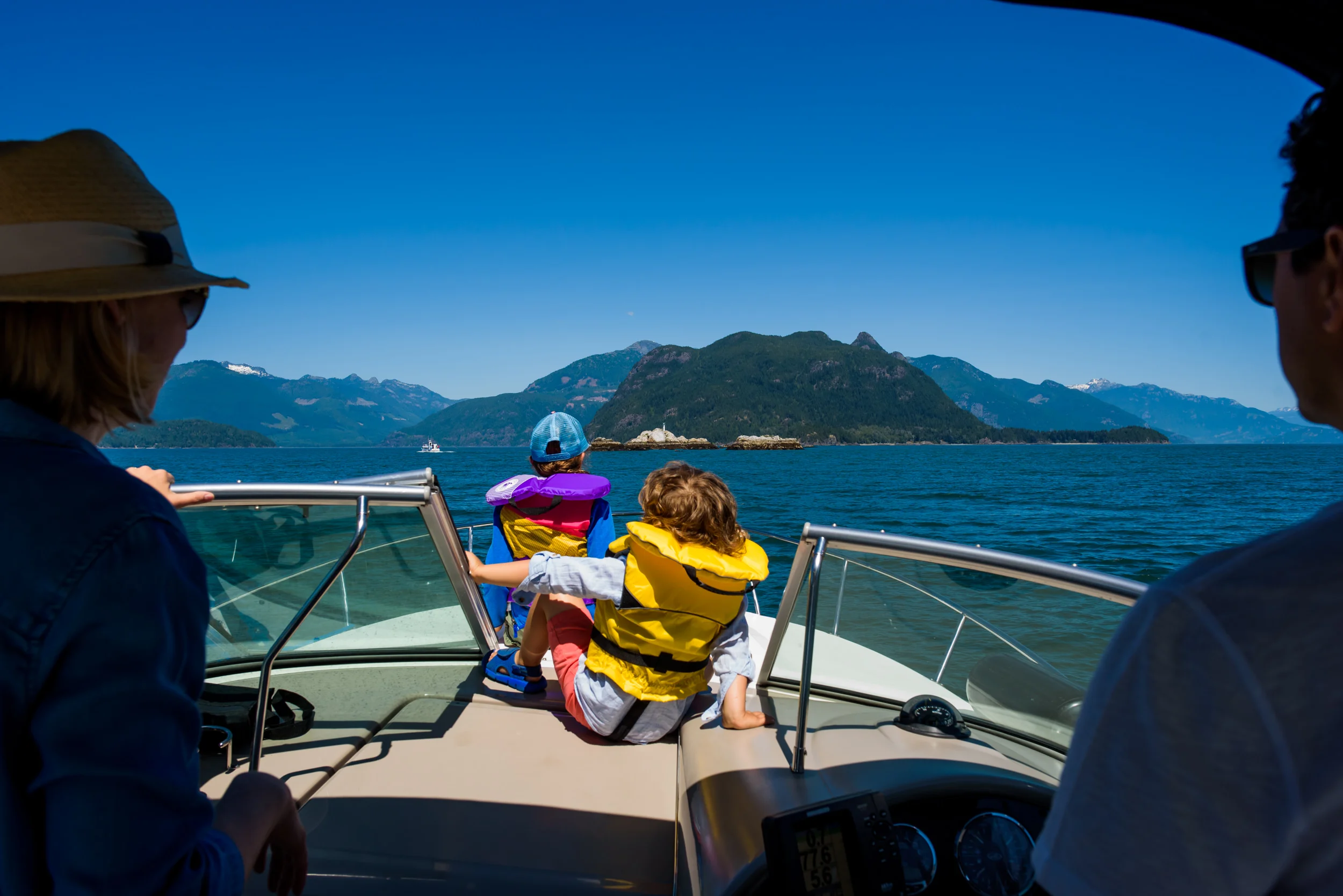 Best vacation photographer Felicia Chang Photography. Family boating around the Christie Islet Bird Sanctuary to check out some habour seals.