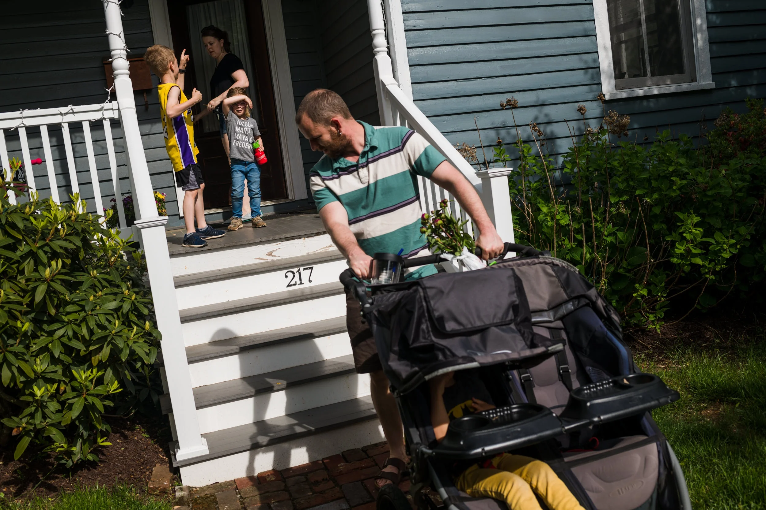 Family coming home from a walk.