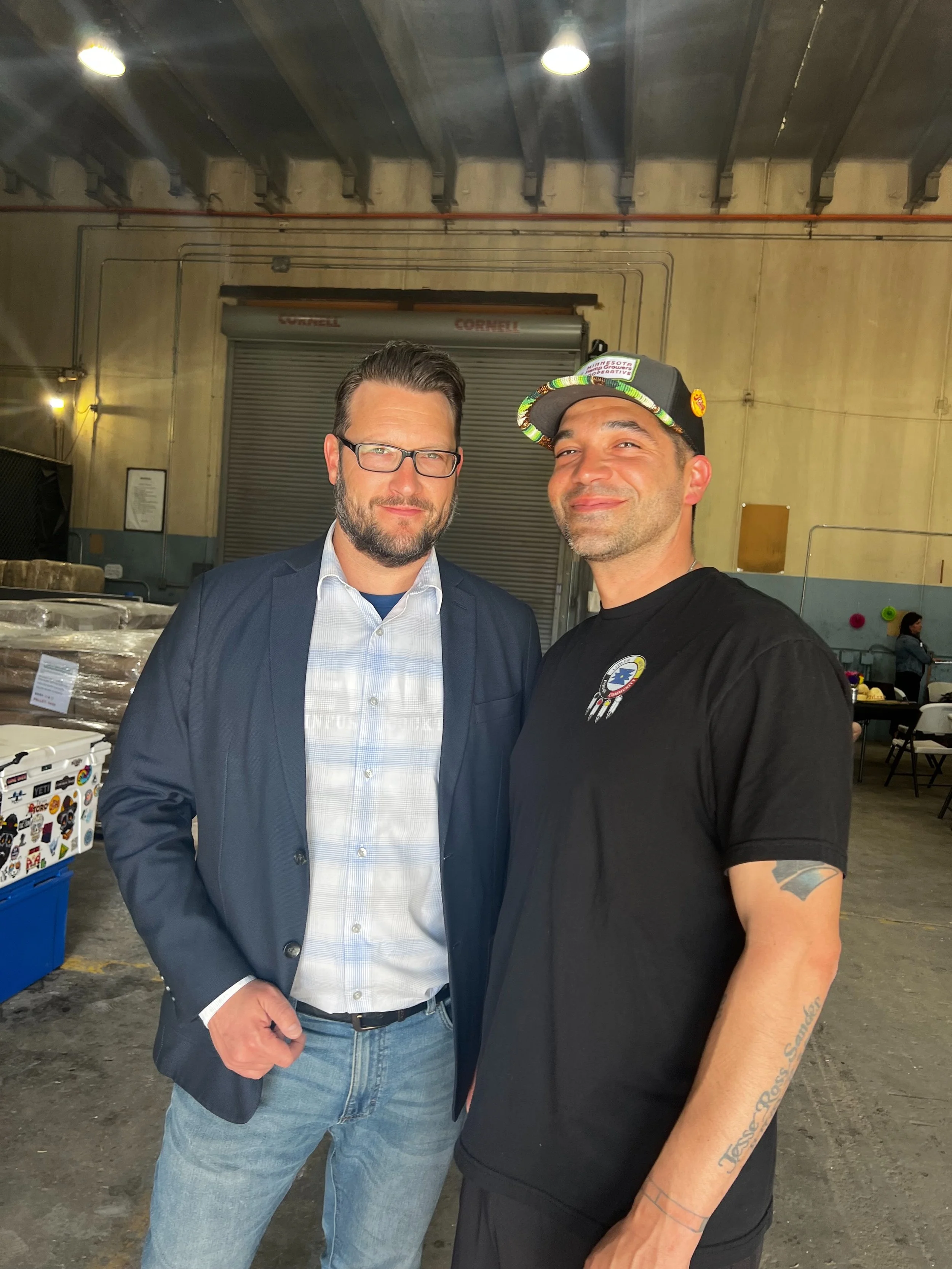 Sully Sullivan, Executive Director of HITA standing with Danny Desjarlais, from the Lower Sioux Tribe