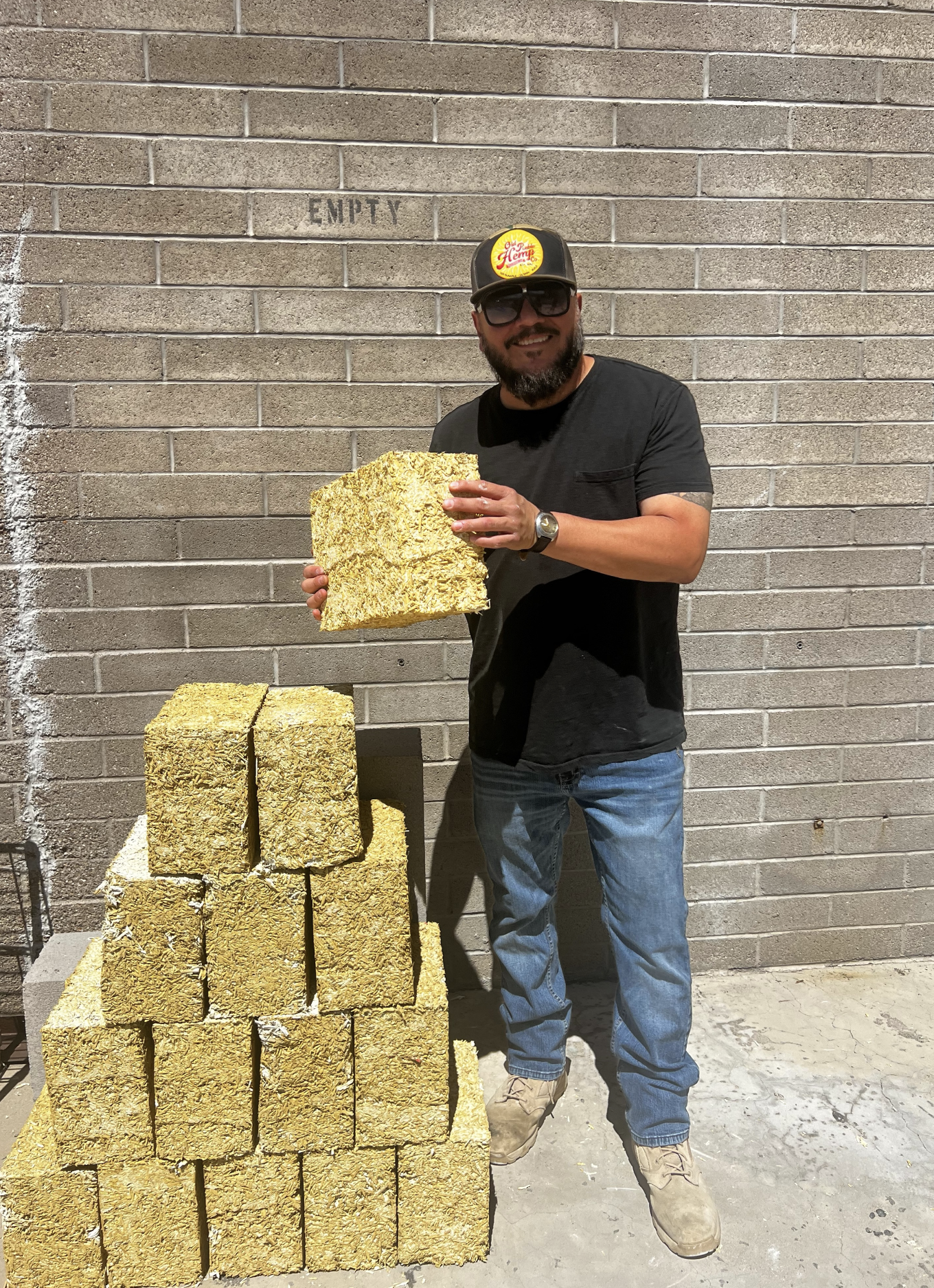 Joe Machado from the Old Pueblo Hemp Co, standing with his hand-made hemplime blocks