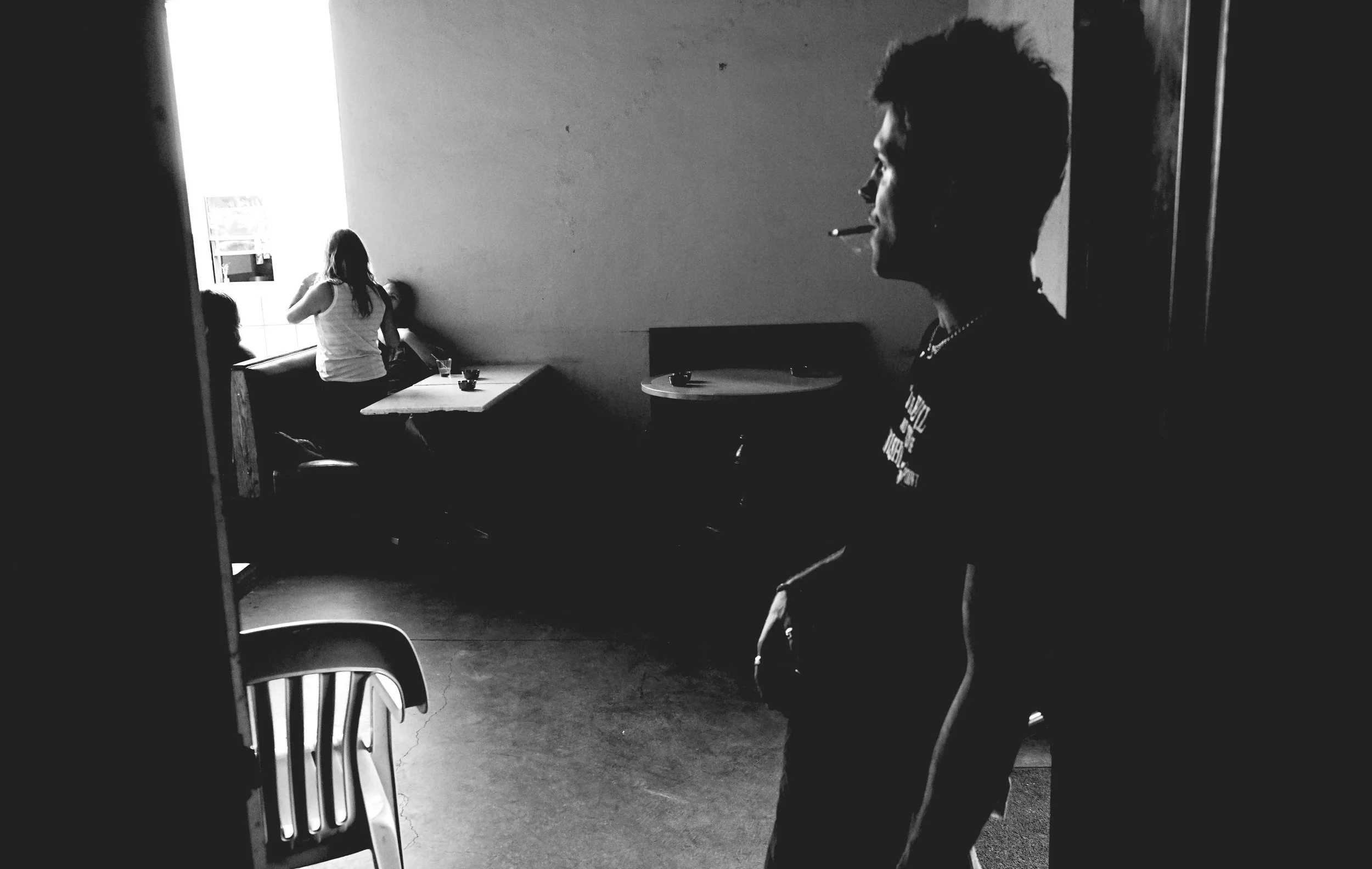 BAR LIGHTS IN THE DUSK SEEM SO FULL OF PROMISE